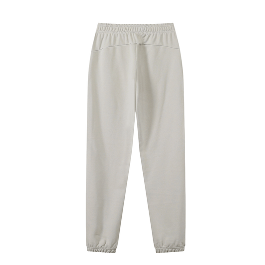 Back of oat gray sweatpants in front of a white background