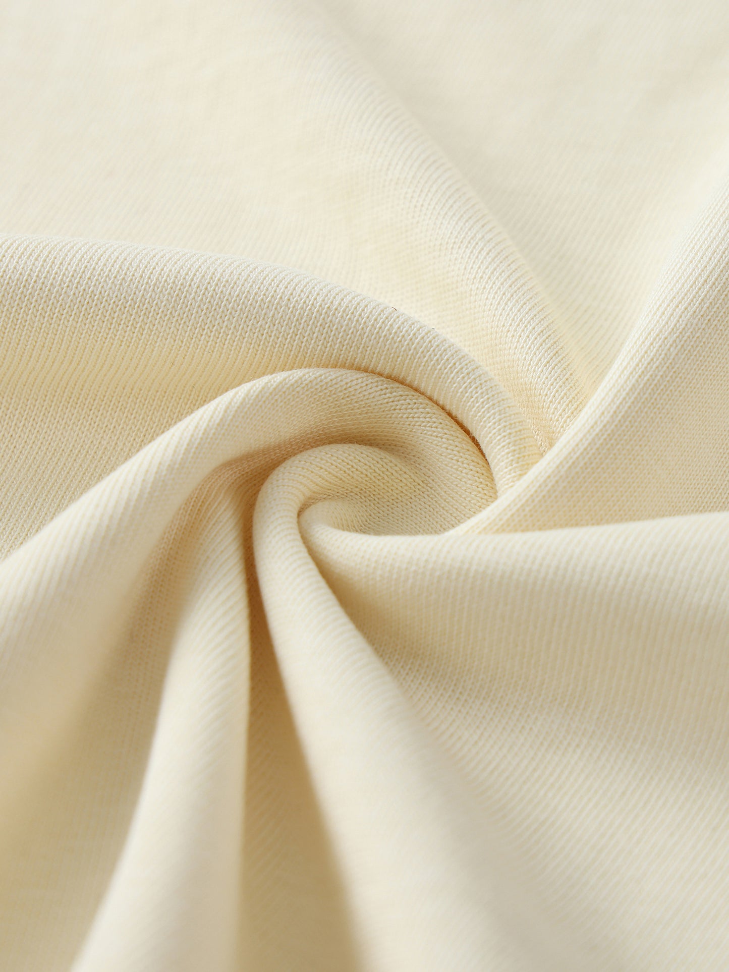 Close-up of beige fabric with rolls/folds