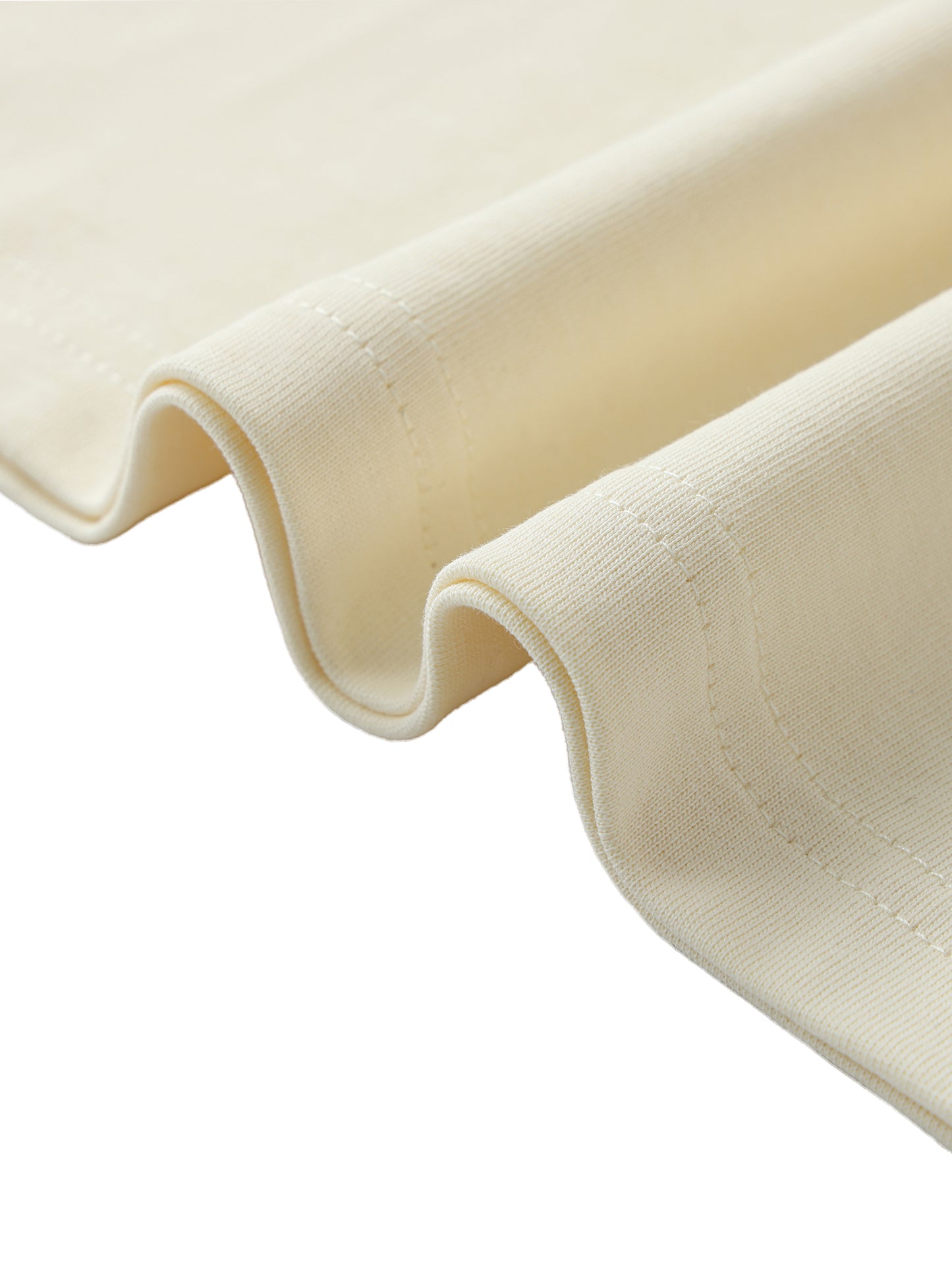 Close-up of beige fabric with a white background