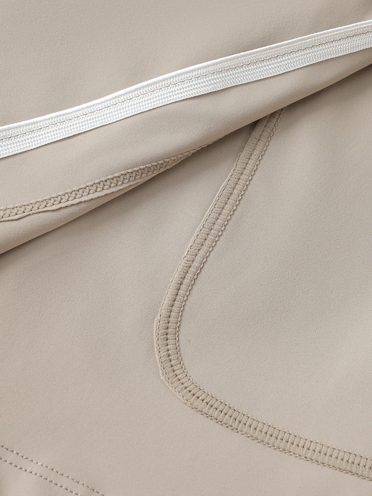 Close-up of beige fabric with stitching details