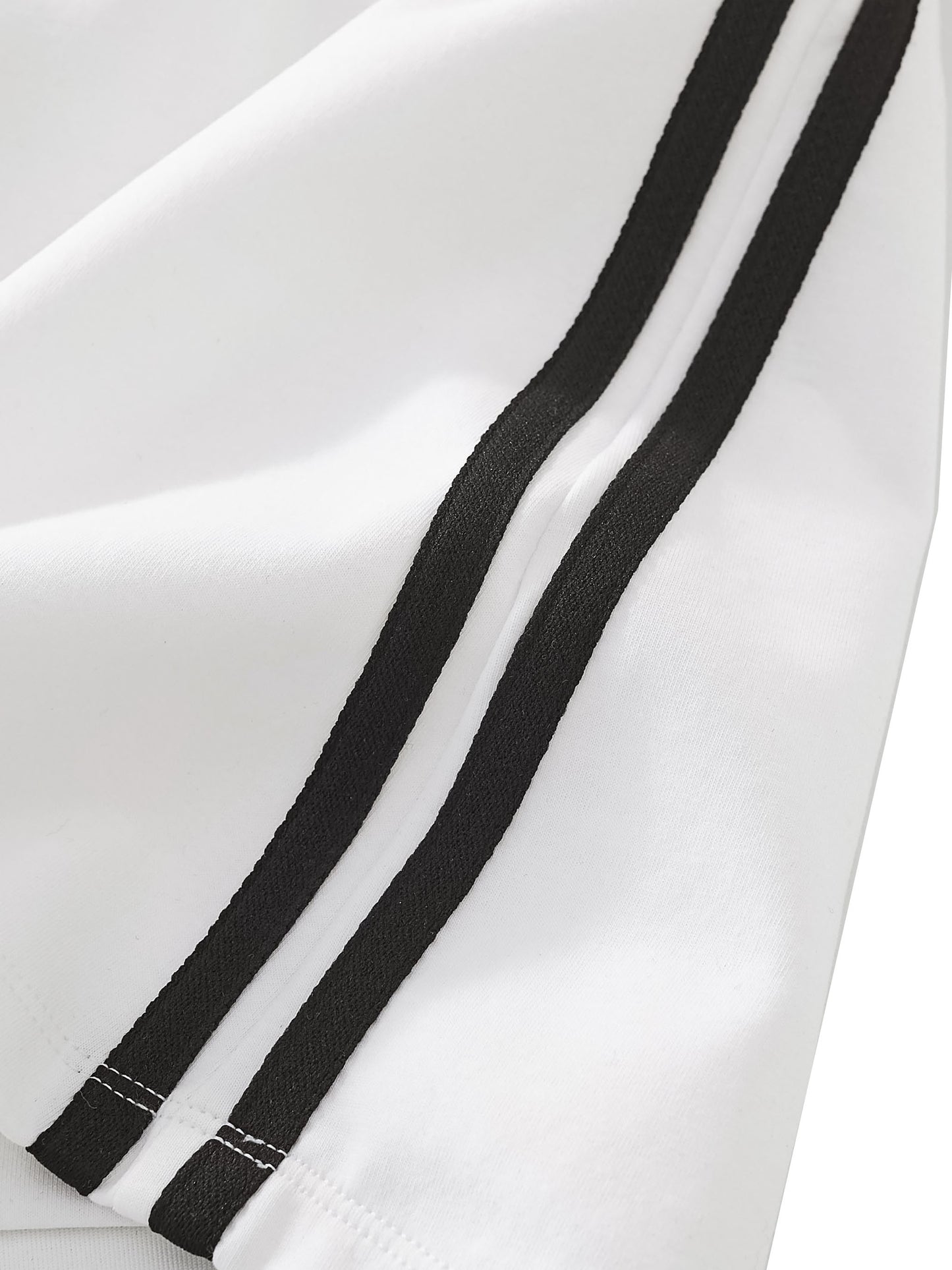 Close-up of a white skirt with black stripes on a white background