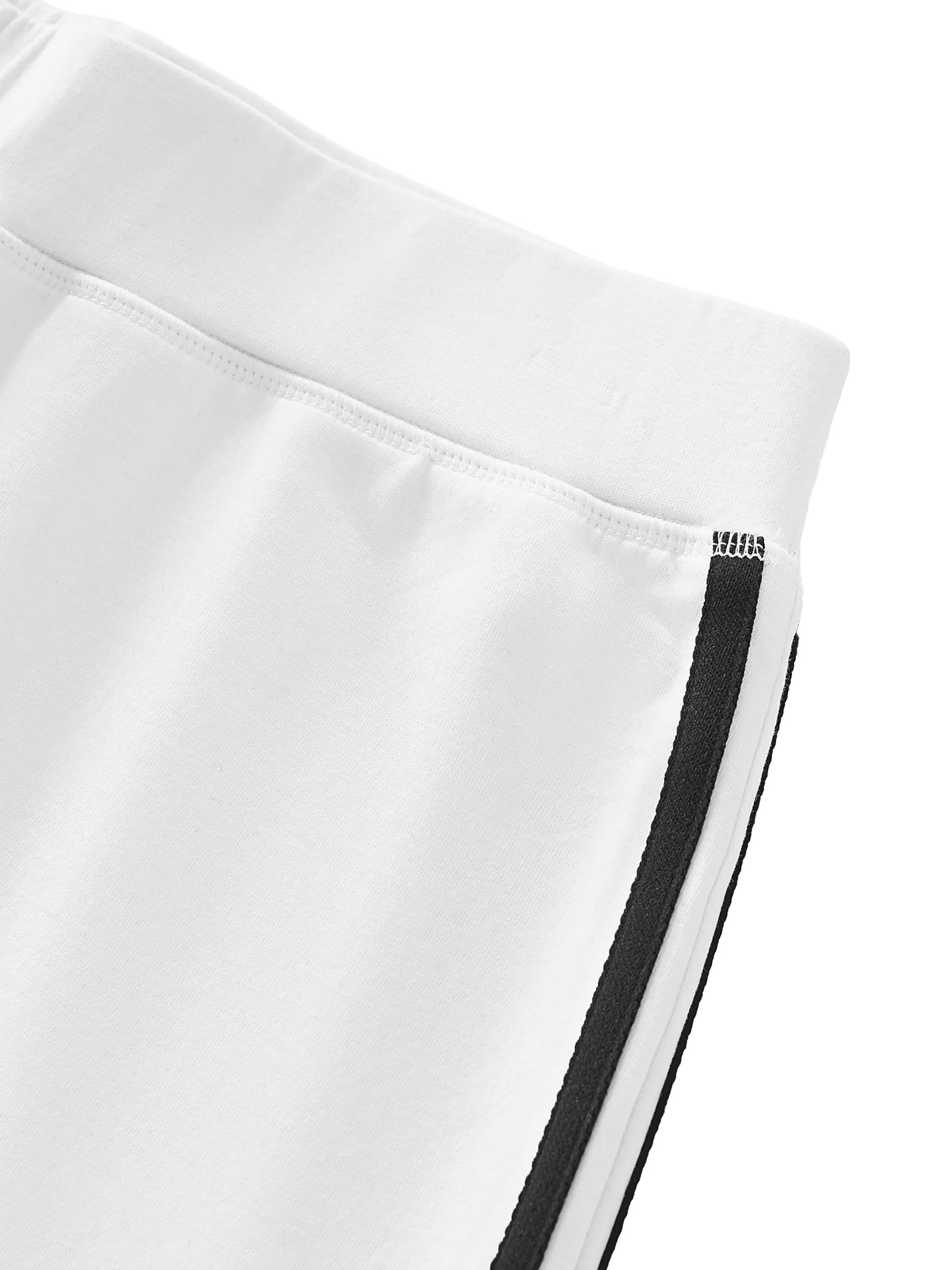 Close-up of a white garment with black trim on a white background
