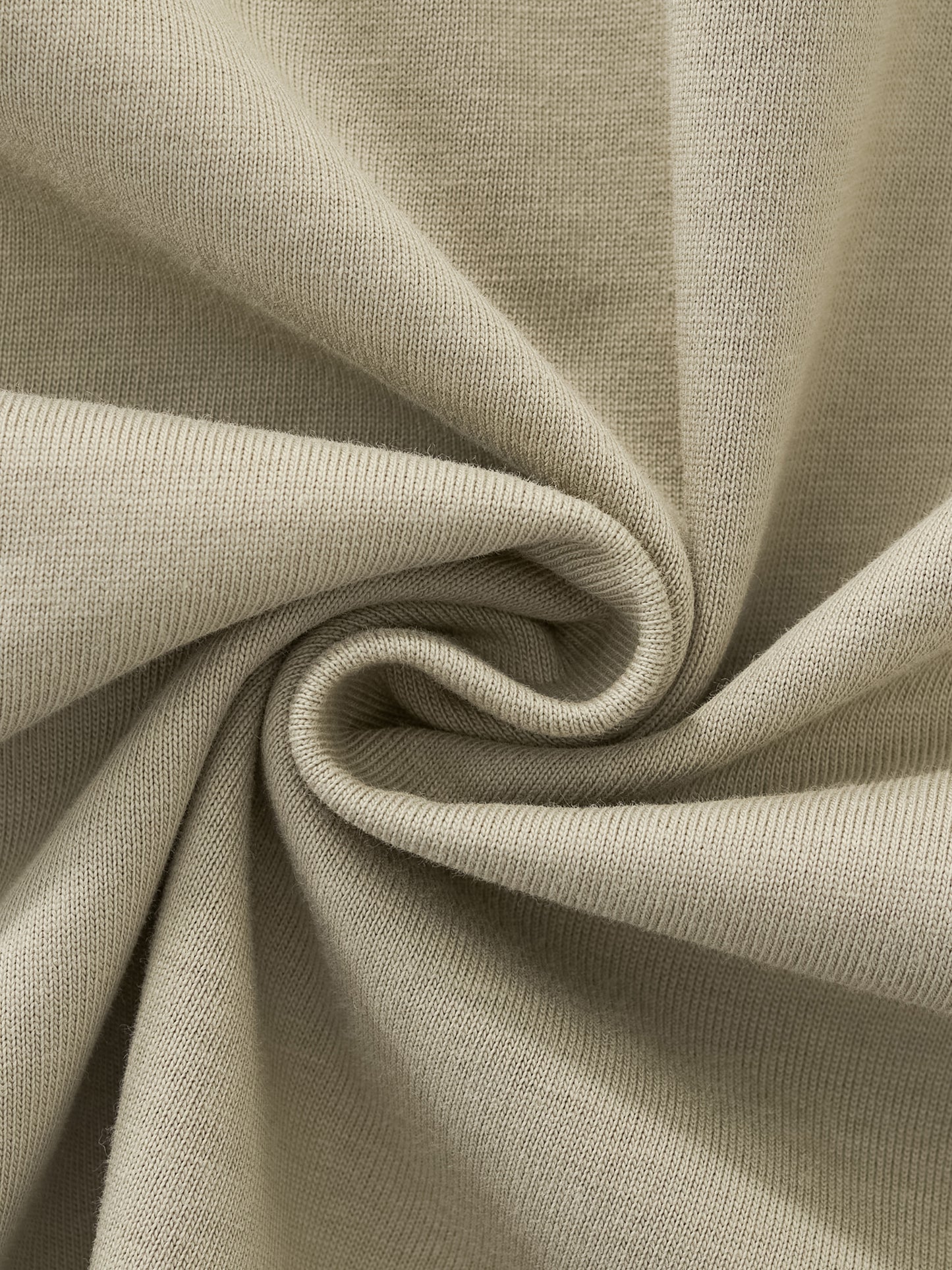 Close-up of beige fabric with swirl pattern