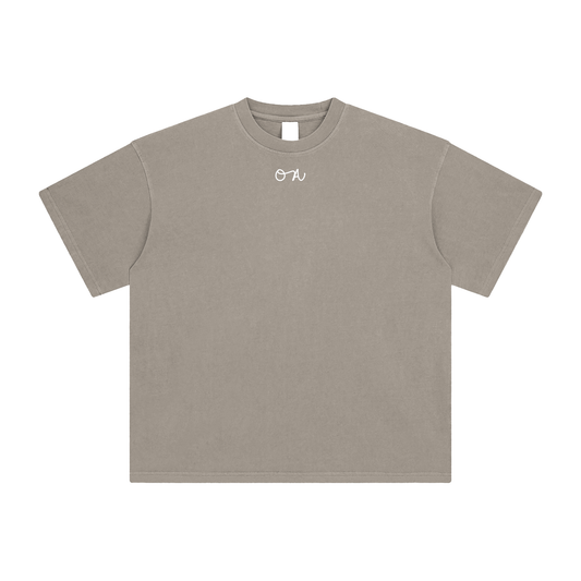Beige t-shirt with an 'OA' logo on a white background