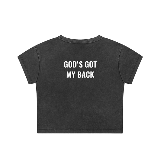 Black t-shirt with 'God's Got My Back' text on a white background