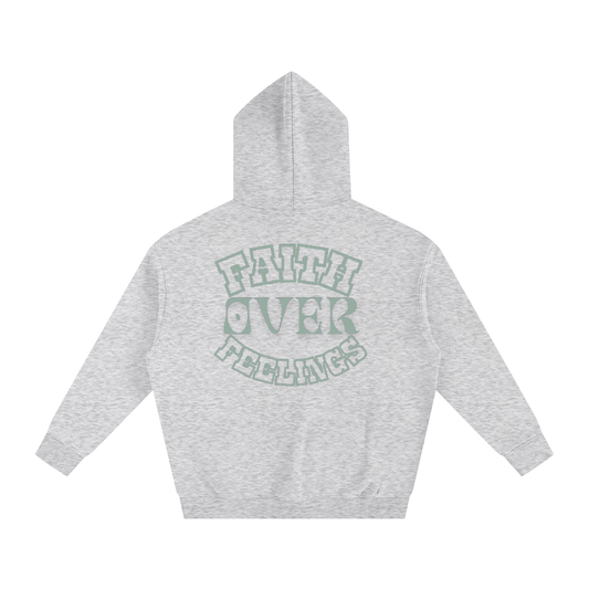 Gray hoodie with 'Faith Over Feelings' text on the back against a white background