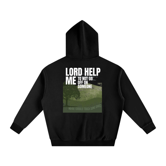 Black hoodie with text and graphic on the back, displayed on a white background. Text says 'lord help me to not go off on someone' and small printed 'maybe I should touch some grass' wording with a nature aesthetic.