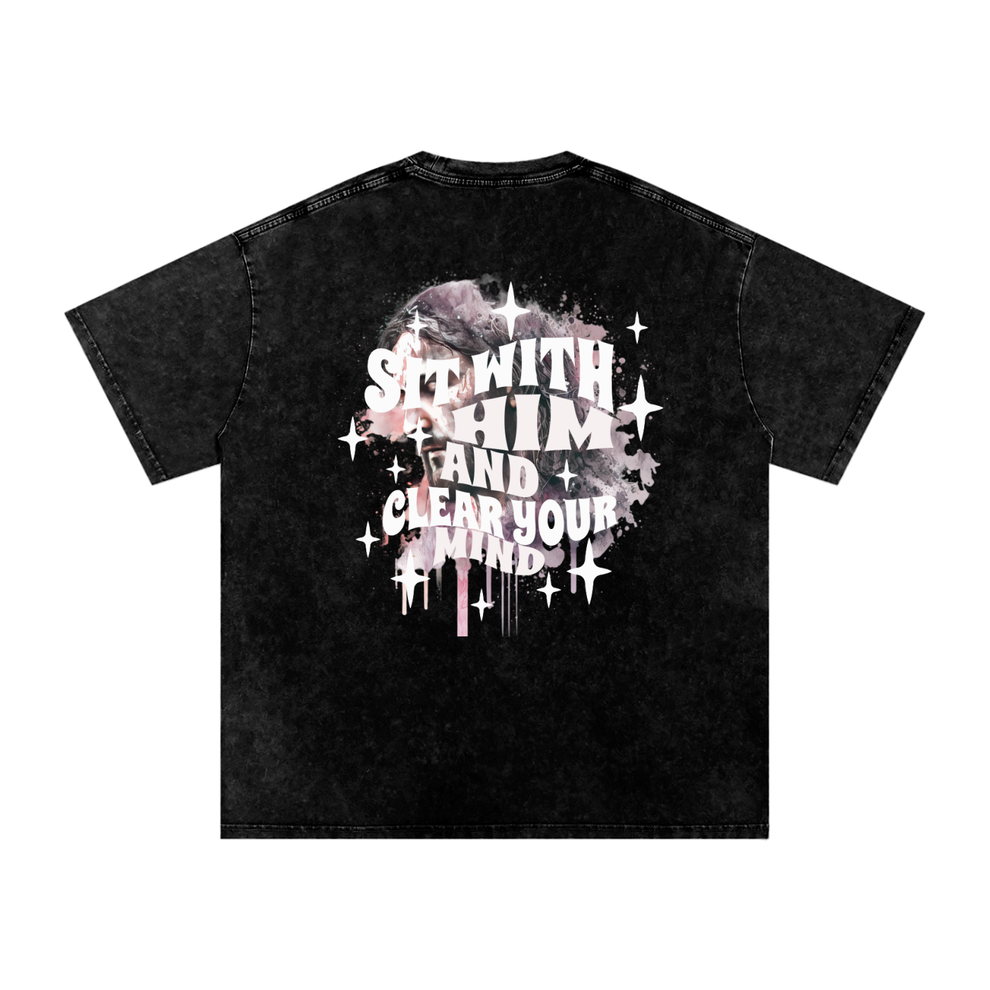 Back of black t-shirt with 'sit with him and clear your mind' text, and a graphic watercolor of Jesus in the colors pink, gray, black, white, and purple, with white sparkles scattered around the design, in front of a white background.