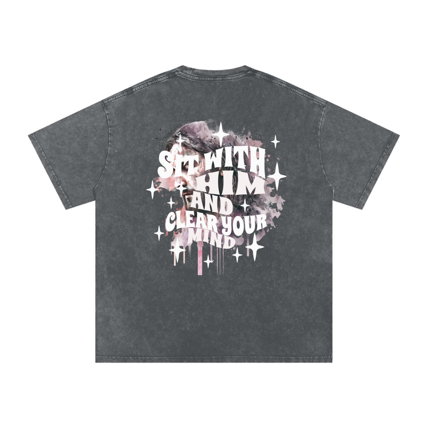 Back of dark gray t-shirt with 'sit with him and clear your mind' text, and a graphic watercolor of Jesus in the colors pink, gray, black, white, and purple, with white sparkles scattered around the design, in front of a white background.
