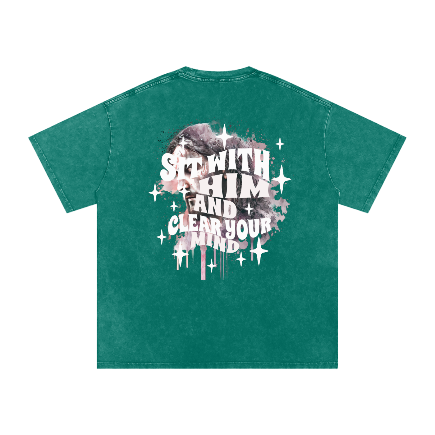 Back of dark green t-shirt with 'sit with him and clear your mind' text, and a graphic watercolor of Jesus in the colors pink, gray, black, white, and purple, with white sparkles scattered around the design, in front of a white background.