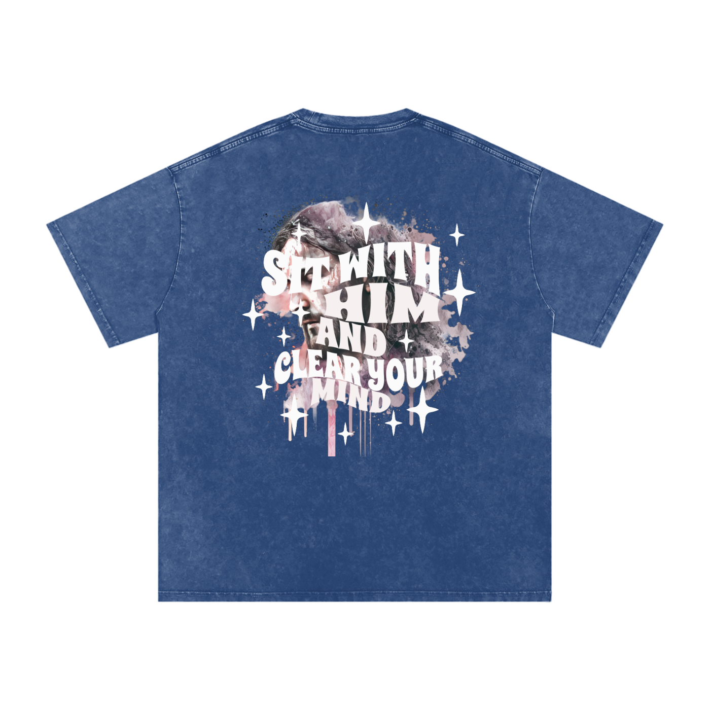 Back of deep blue t-shirt with 'sit with him and clear your mind' text, and a graphic watercolor of Jesus in the colors pink, gray, black, white, and purple, with white sparkles scattered around the design, in front of a white background.