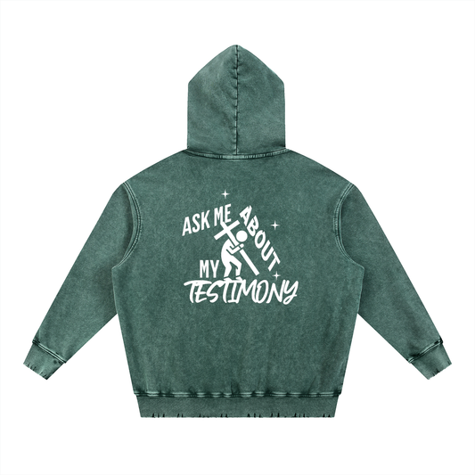 Forest Green hoodie with text on the back on a white background. Text says: "Ask me about my testimony" with person carrying the cross graphic design all in white color.