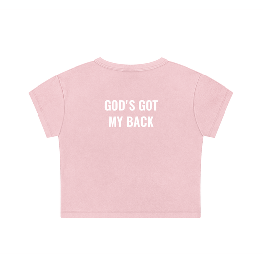 Pink t-shirt with 'GOD'S GOTMYBACK' text on a white background