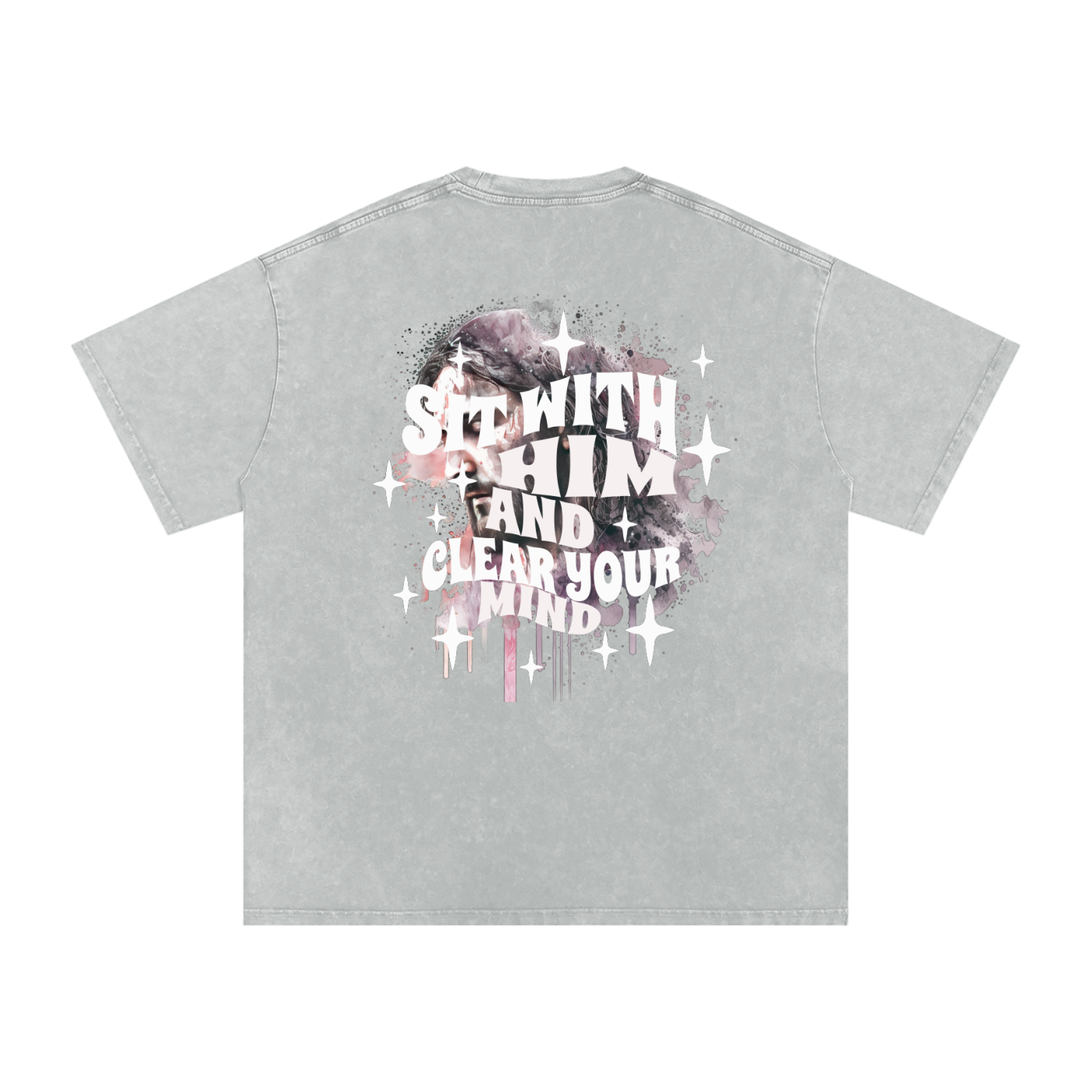 Back of light gray t-shirt with 'sit with him and clear your mind' text, and a graphic watercolor of Jesus in the colors pink, gray, black, white, and purple, with white sparkles scattered around the design, in front of a white background.