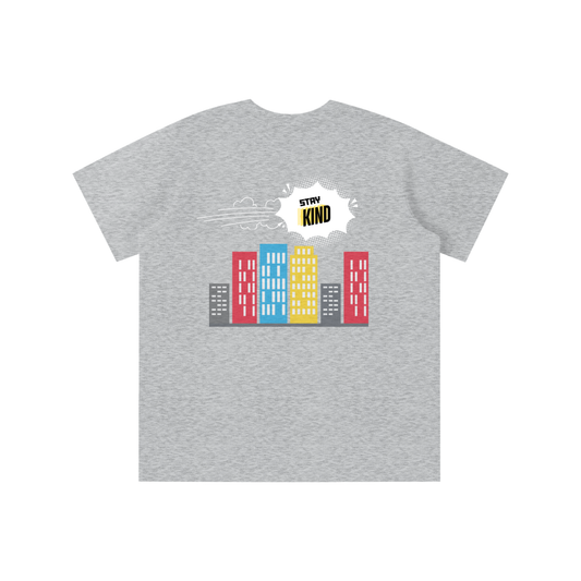 Gray t-shirt with colorful building graphic and 'Stay Kind' text on a white background