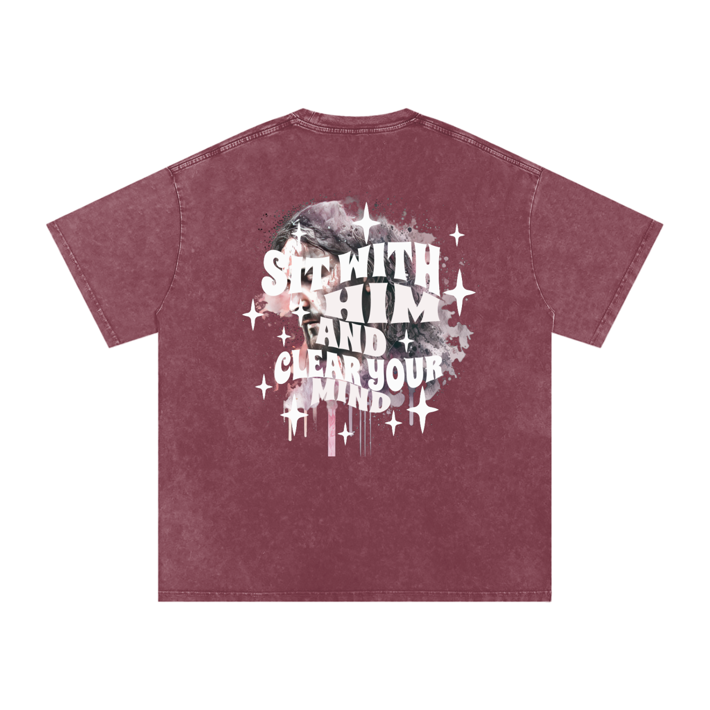 Back of light maroon t-shirt with 'sit with him and clear your mind' text, and a graphic watercolor of Jesus in the colors pink, gray, black, white, and purple, with white sparkles scattered around the design, in front of a white background.