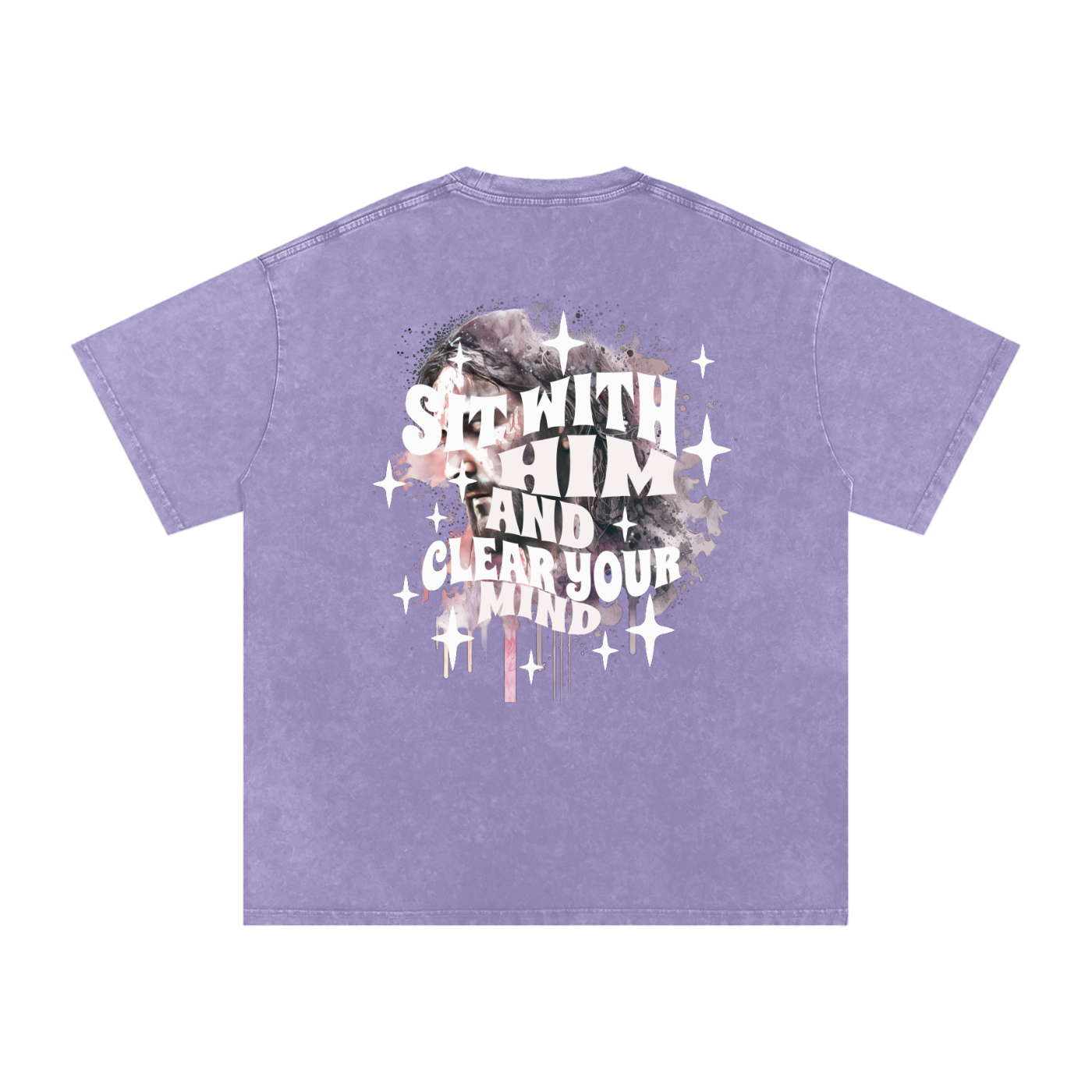 Back of light purple t-shirt with 'sit with him and clear your mind' text, and a graphic watercolor of Jesus in the colors pink, gray, black, white, and purple, with white sparkles scattered around the design, in front of a white background.