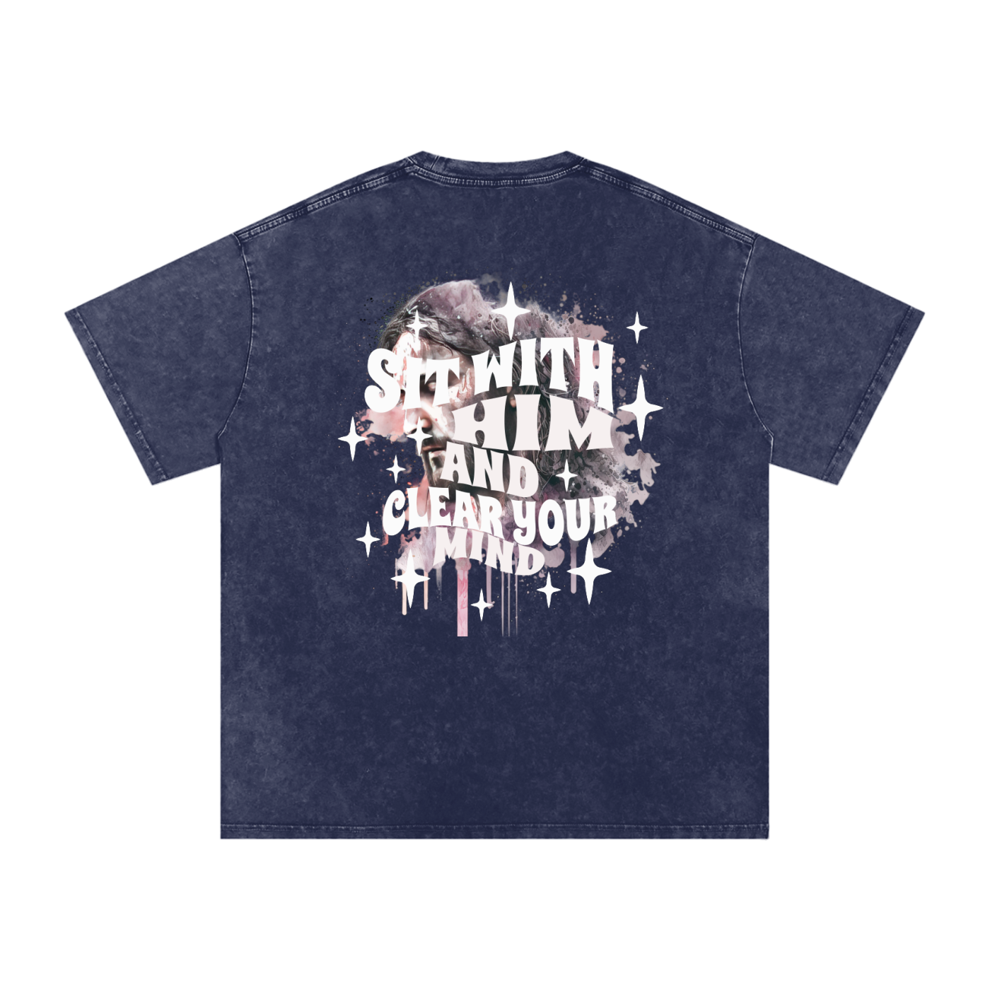 Back of navy blue t-shirt with 'sit with him and clear your mind' text, and a graphic watercolor of Jesus in the colors pink, gray, black, white, and purple, with white sparkles scattered around the design, in front of a white background.