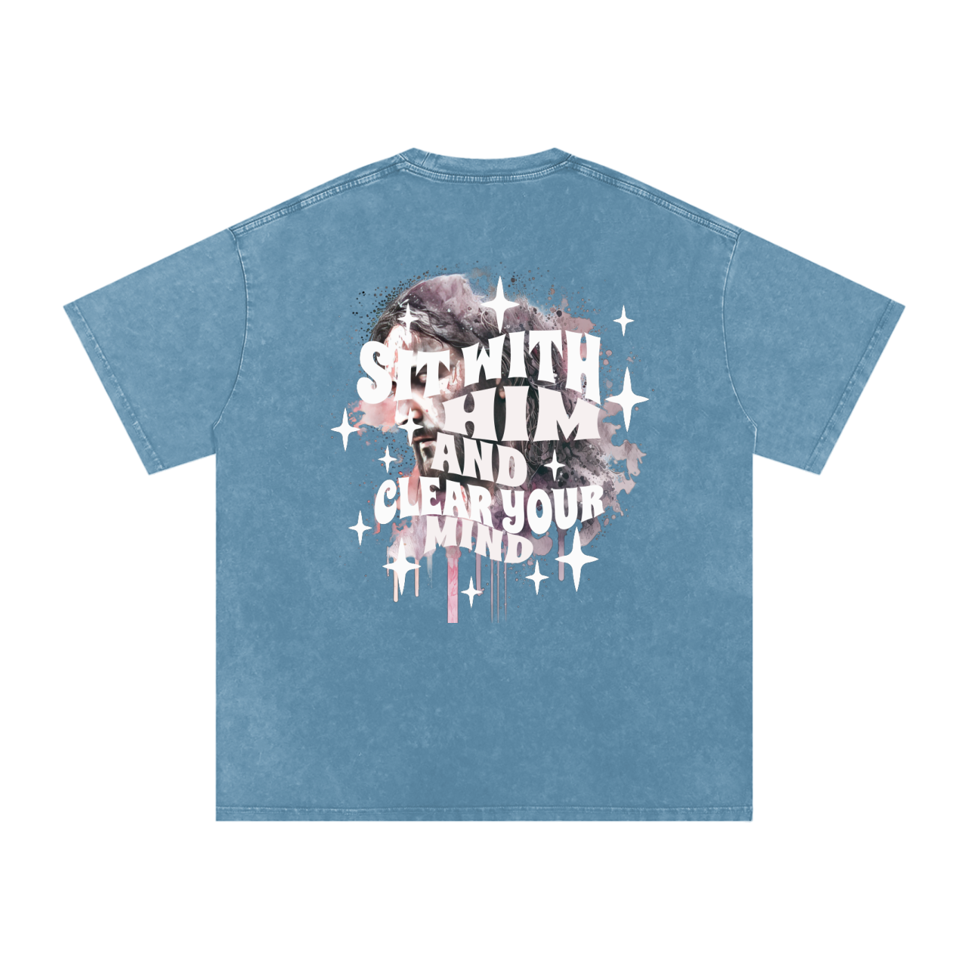 Back of ocean blue t-shirt with 'sit with him and clear your mind' text, and a graphic watercolor of Jesus in the colors pink, gray, black, white, and purple, with white sparkles scattered around the design, in front of a white background.
