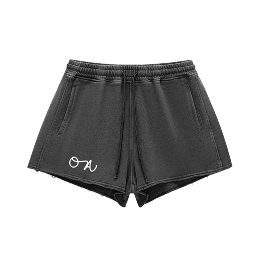 Black shorts with a white logo on a white background