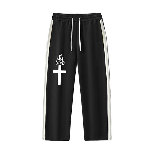 Black pants with a white cross and flame design on a white background
