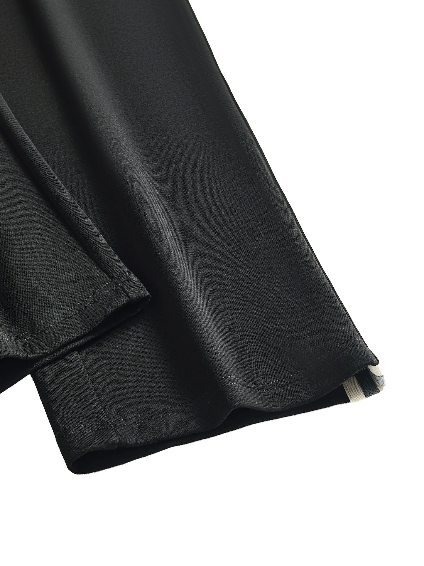 Black fabric with a slight texture on a white background