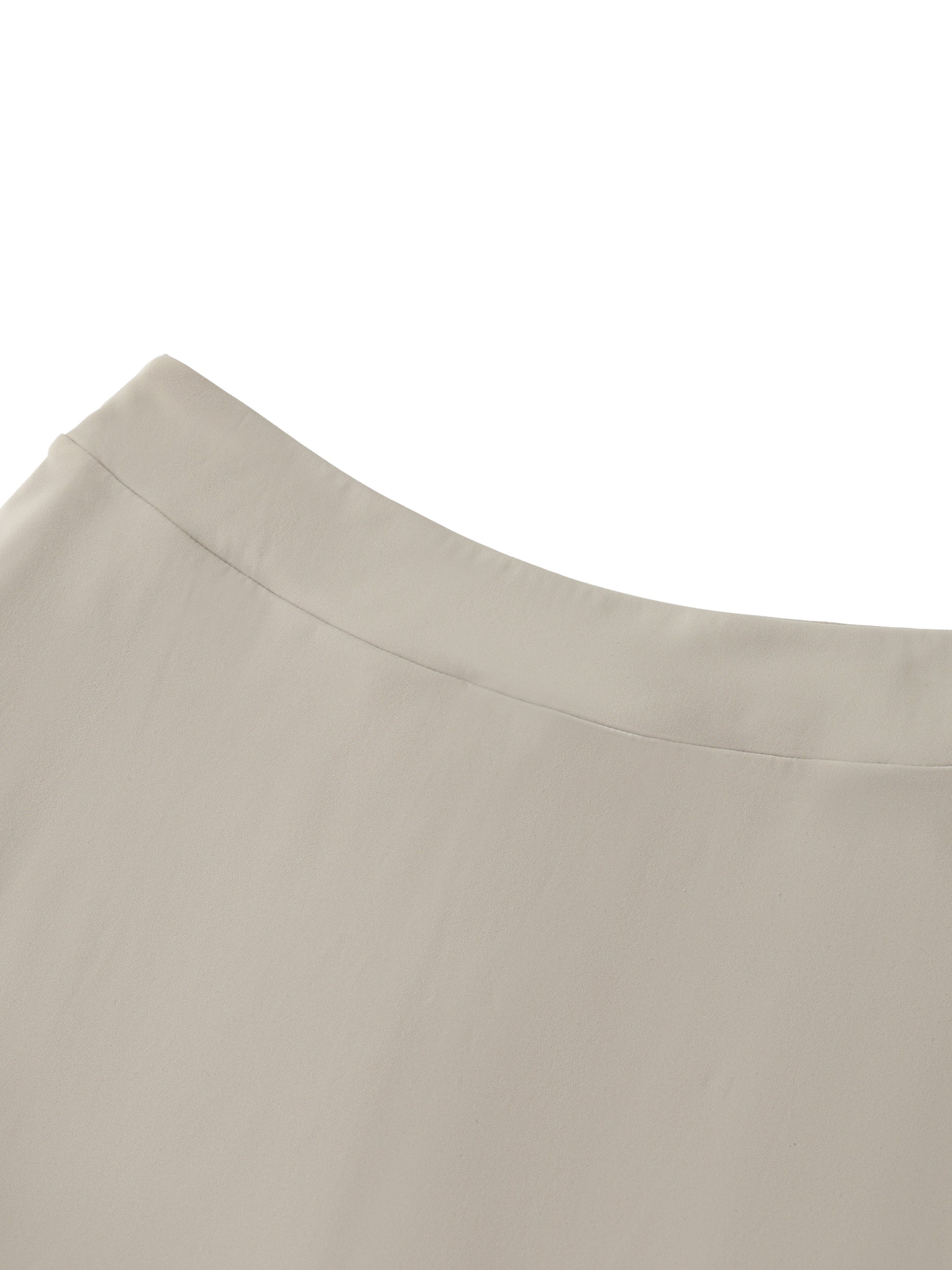Close-up of beige fabric with a subtle texture on a white background