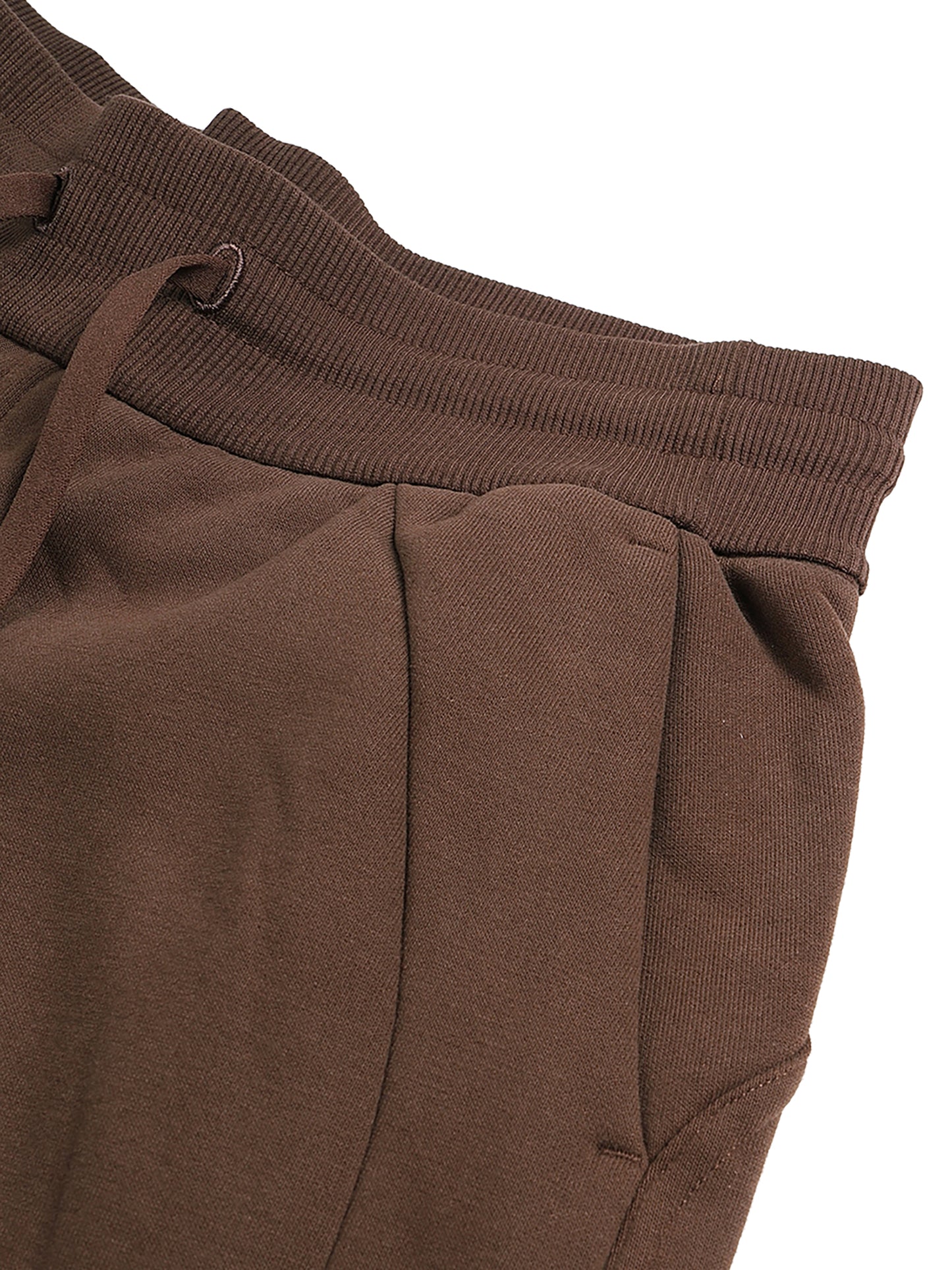 Close-up of brown sweatpants with a drawstring on a white background