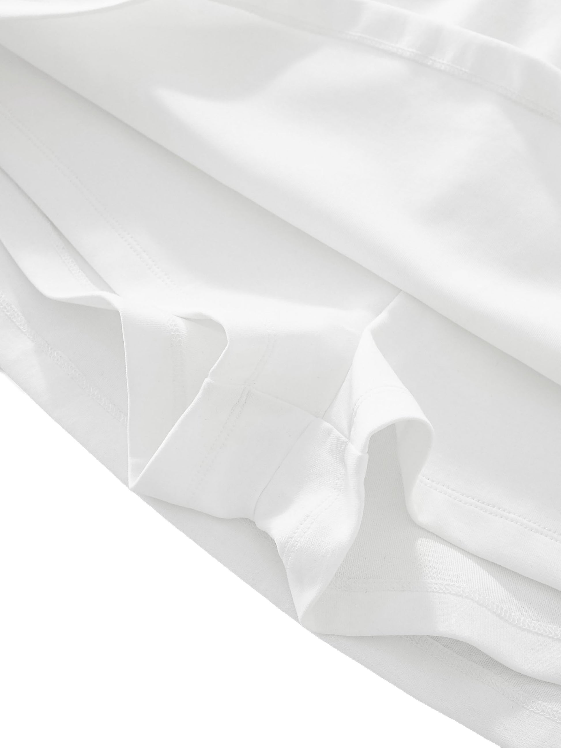 Close-up of white fabric with folds on a white background
