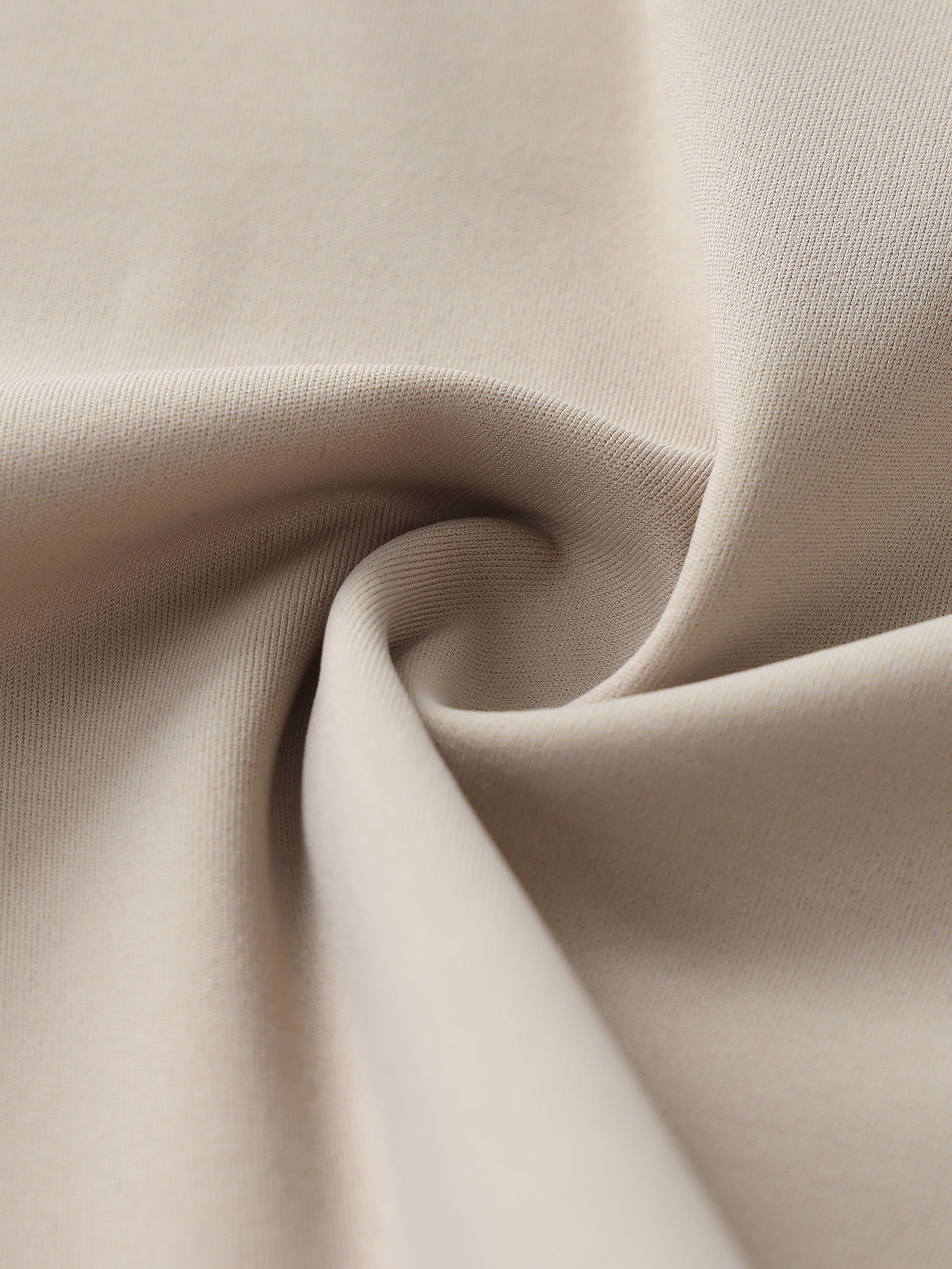 Close-up of beige fabric with folds