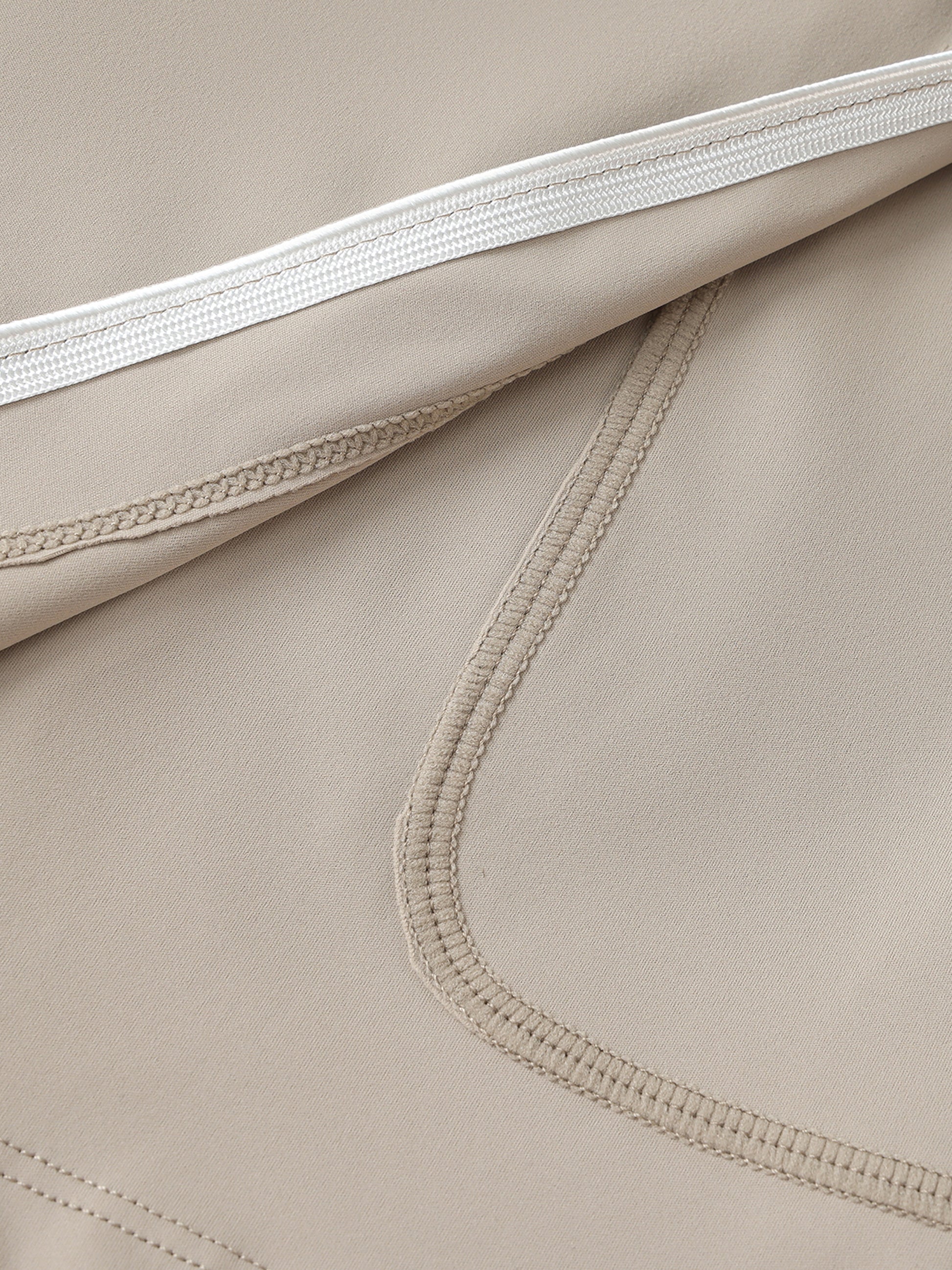 Close-up of beige fabric with stitching details