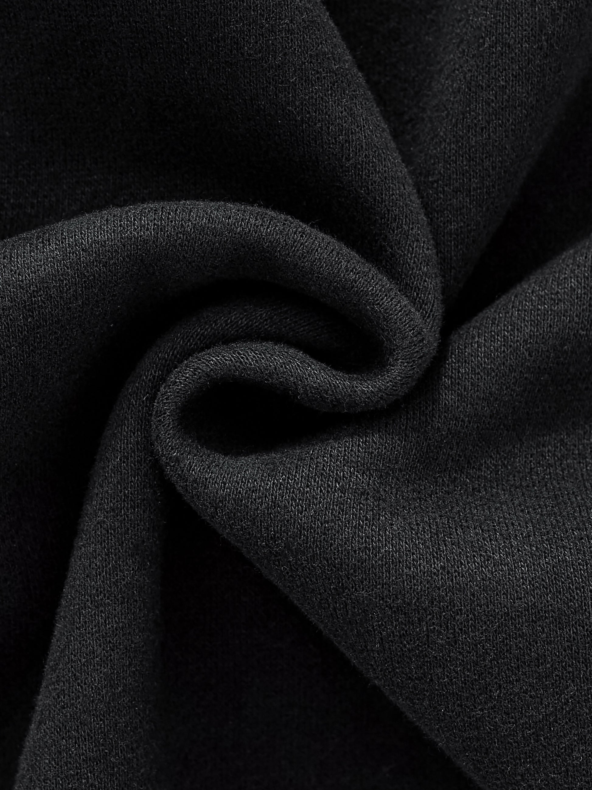 Close-up of black fabric with folds
