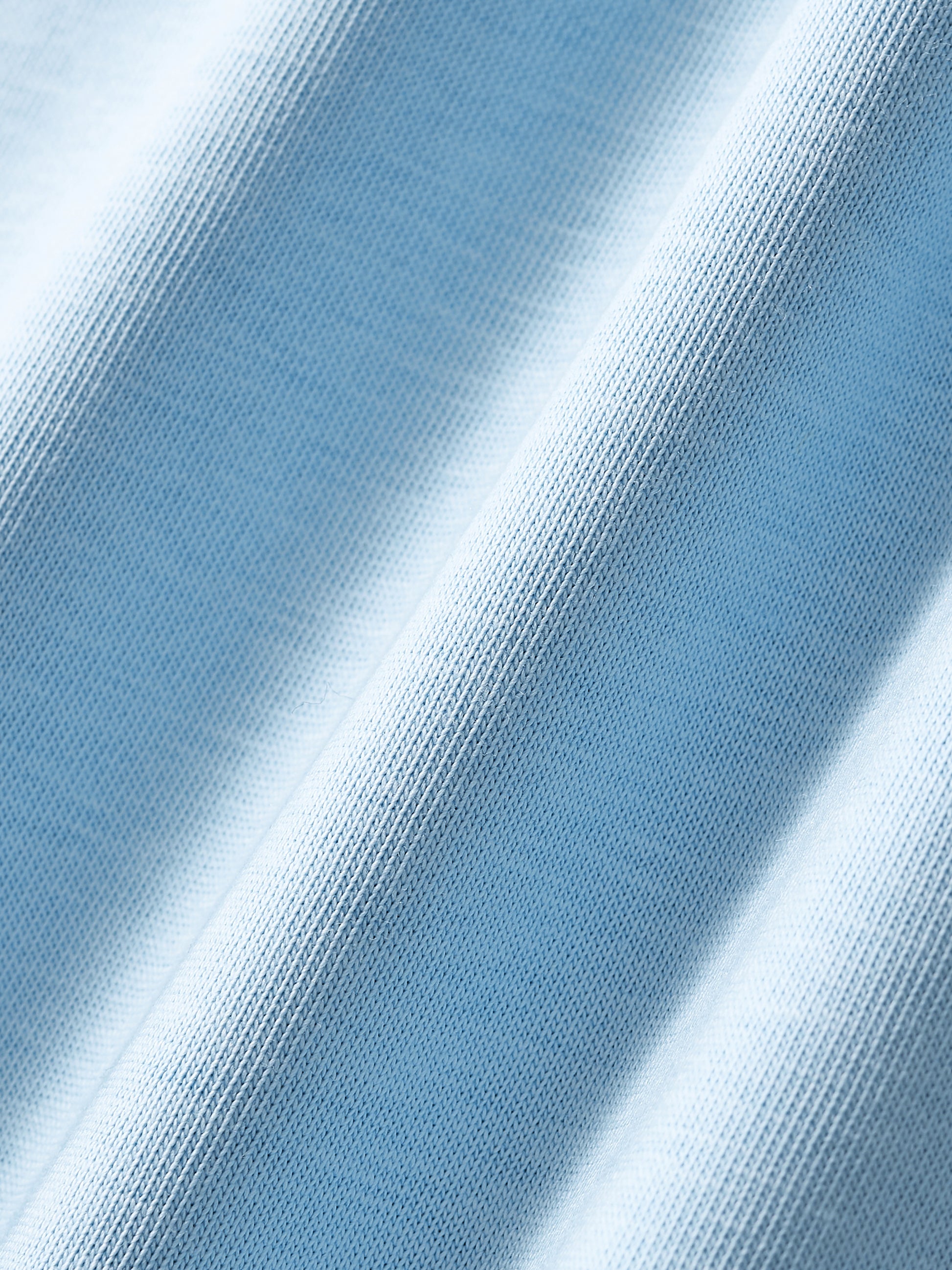 Close-up of blue fabric with a textured pattern