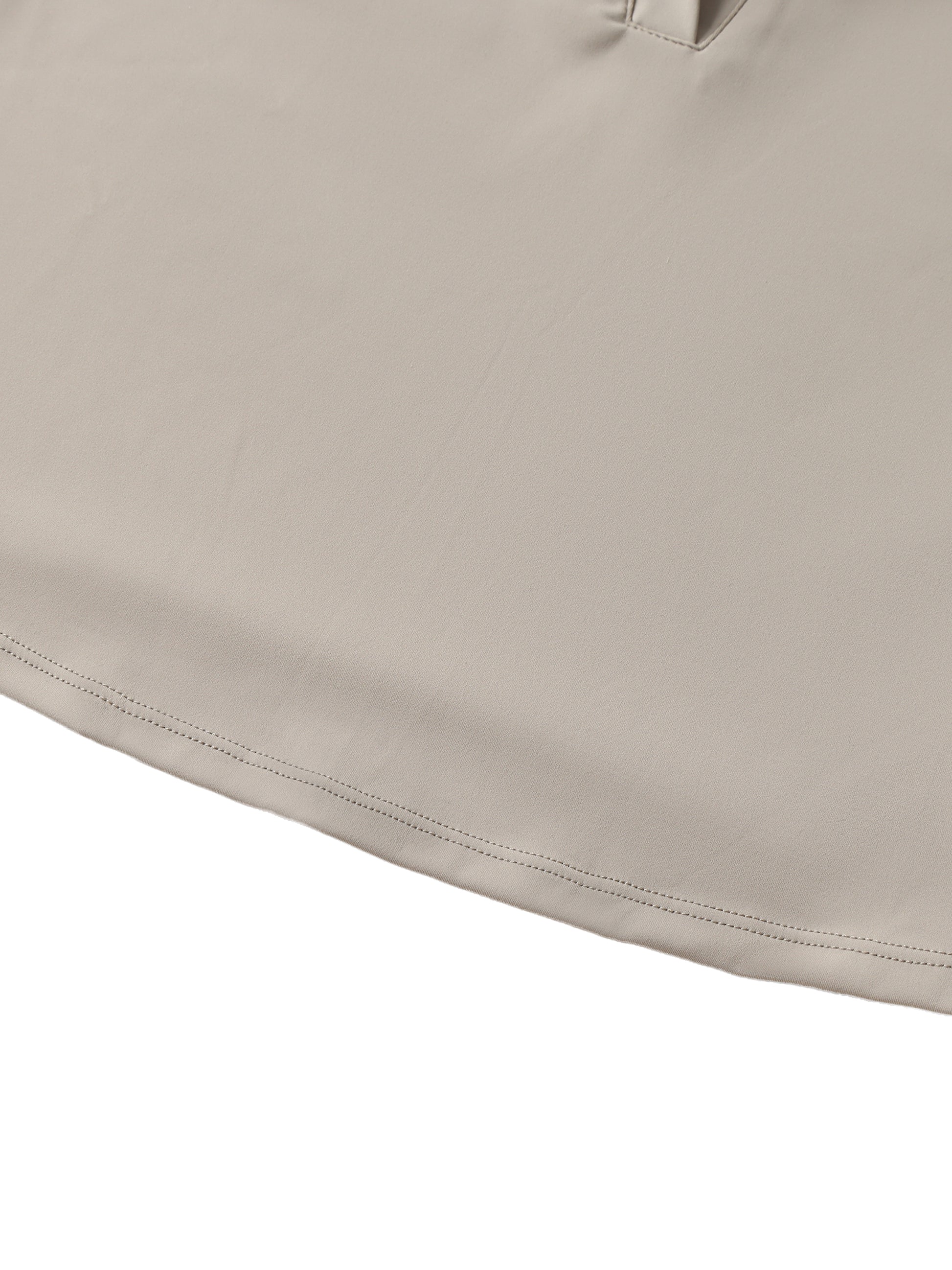 Close-up of beige fabric with a subtle texture on a white background