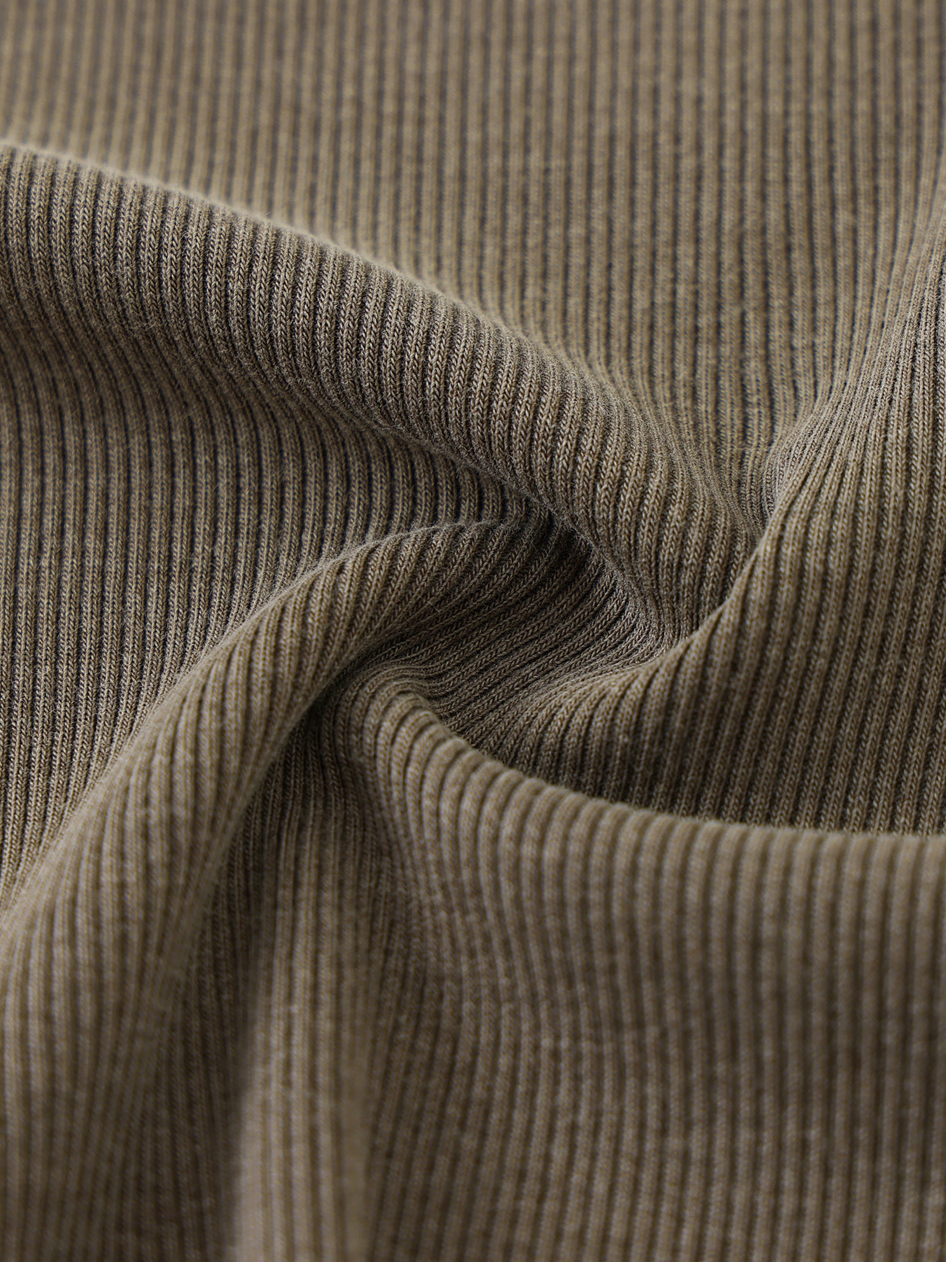 Close-up of brown ribbed fabric texture