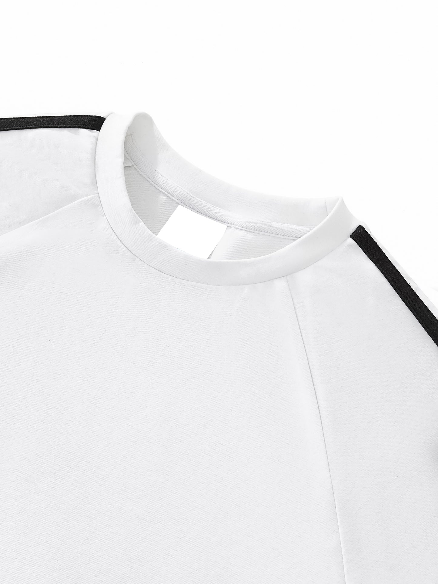 Close-up of a white shirt with black trim on a white background