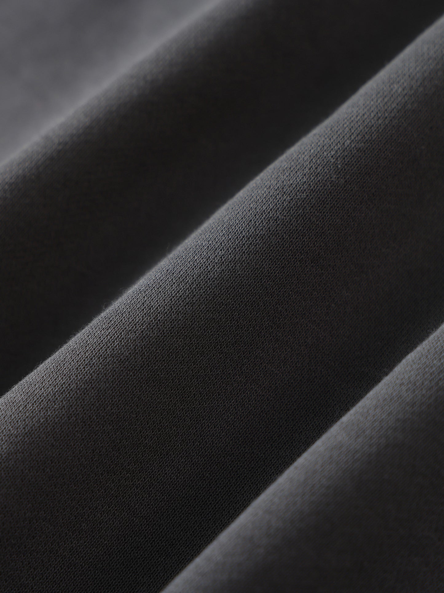 Close-up of black fabric with folds