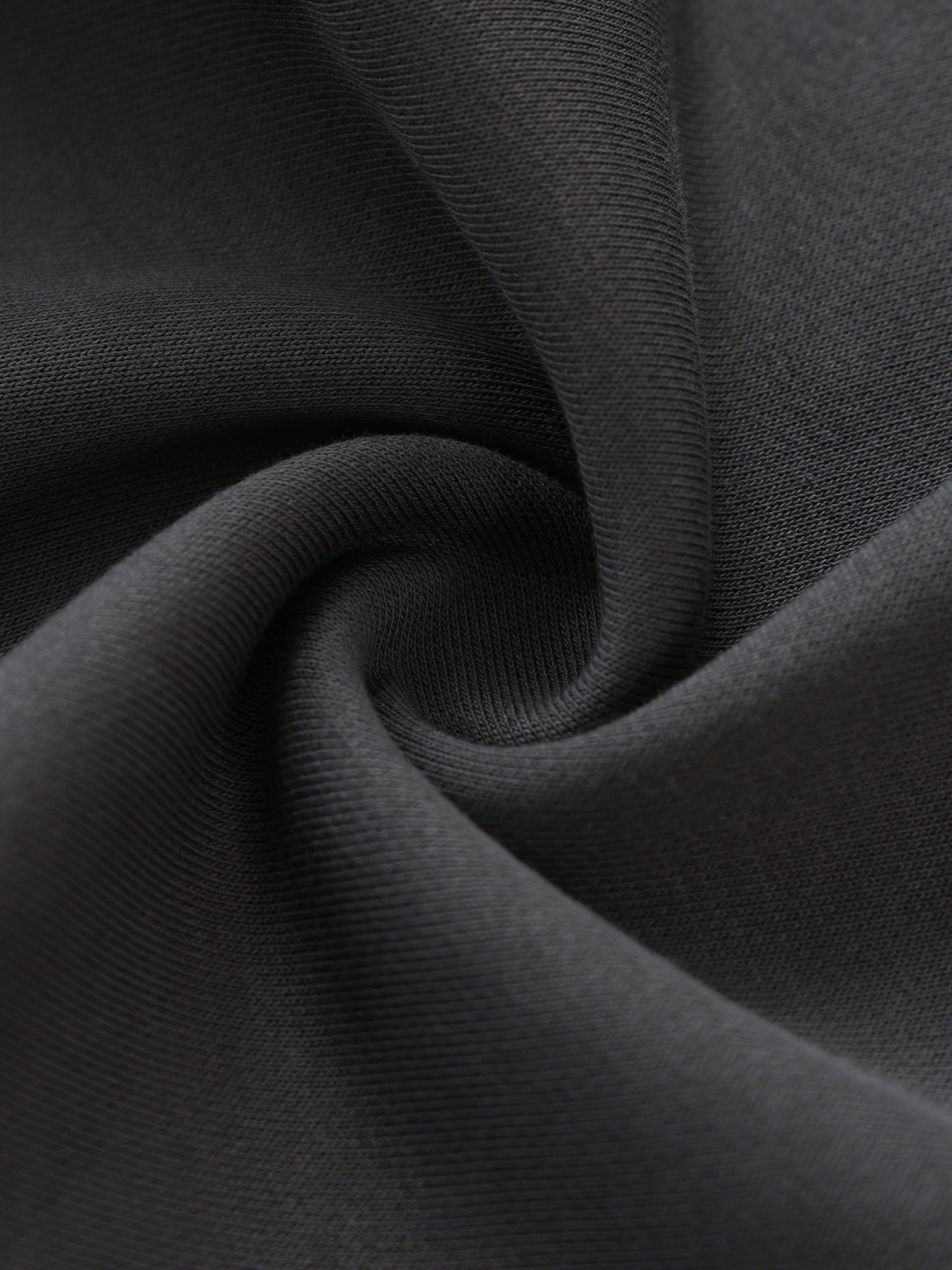 Close-up of dark gray fabric with folds