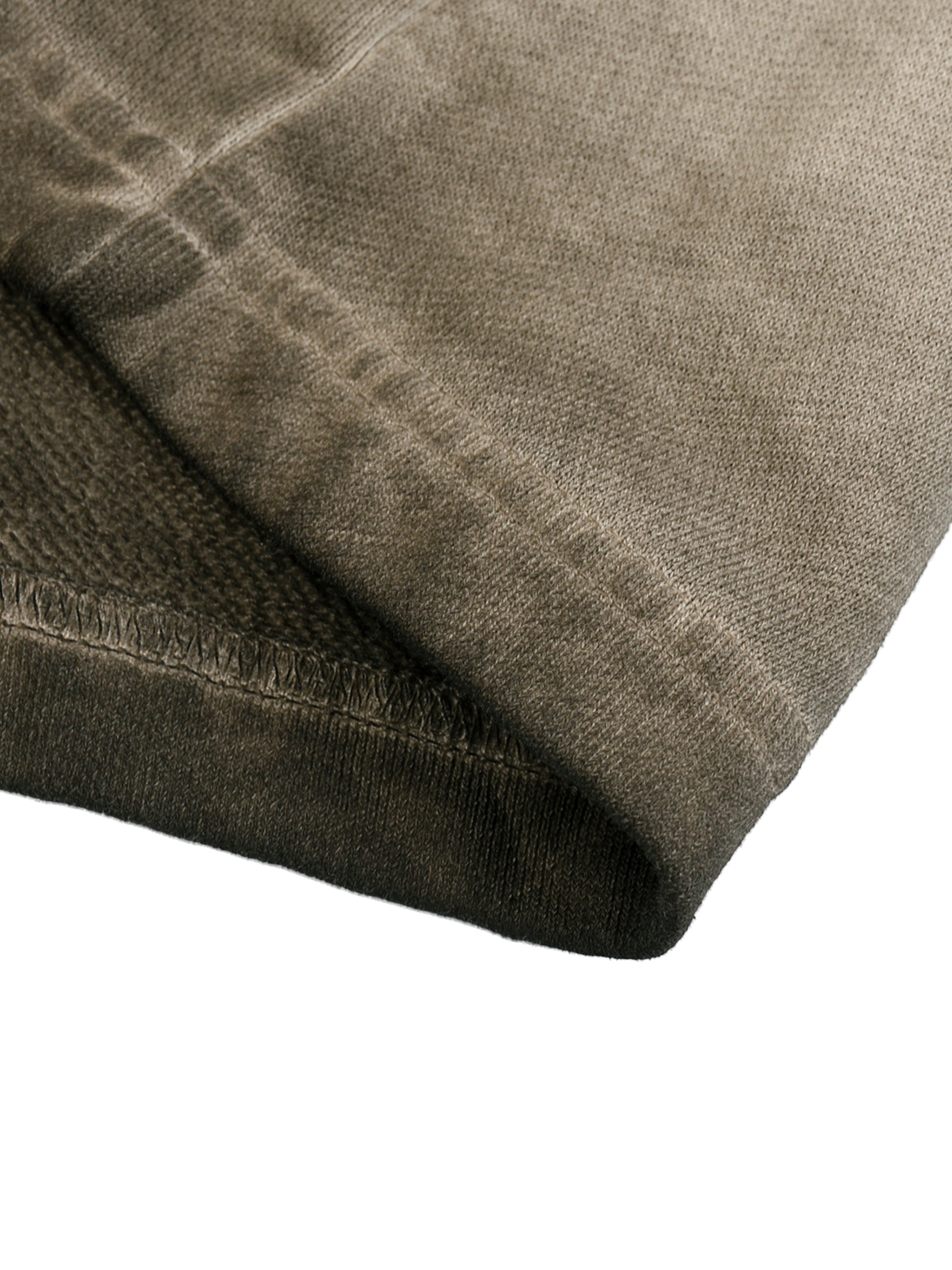 Close-up of a folded brown fabric item on a white background