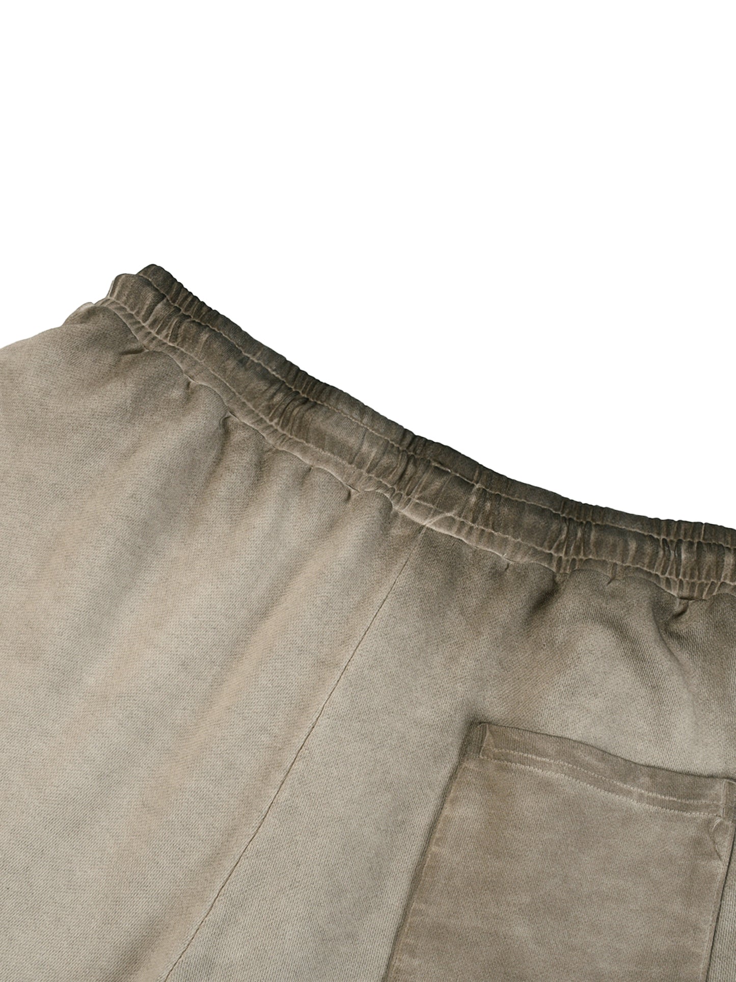 Close-up of beige pants with a pocket on a white background