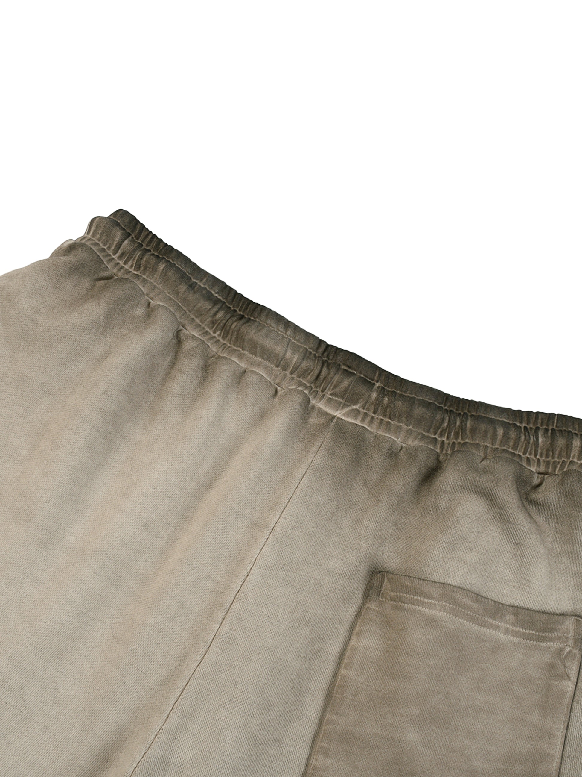Close-up of beige pants with a pocket on a white background