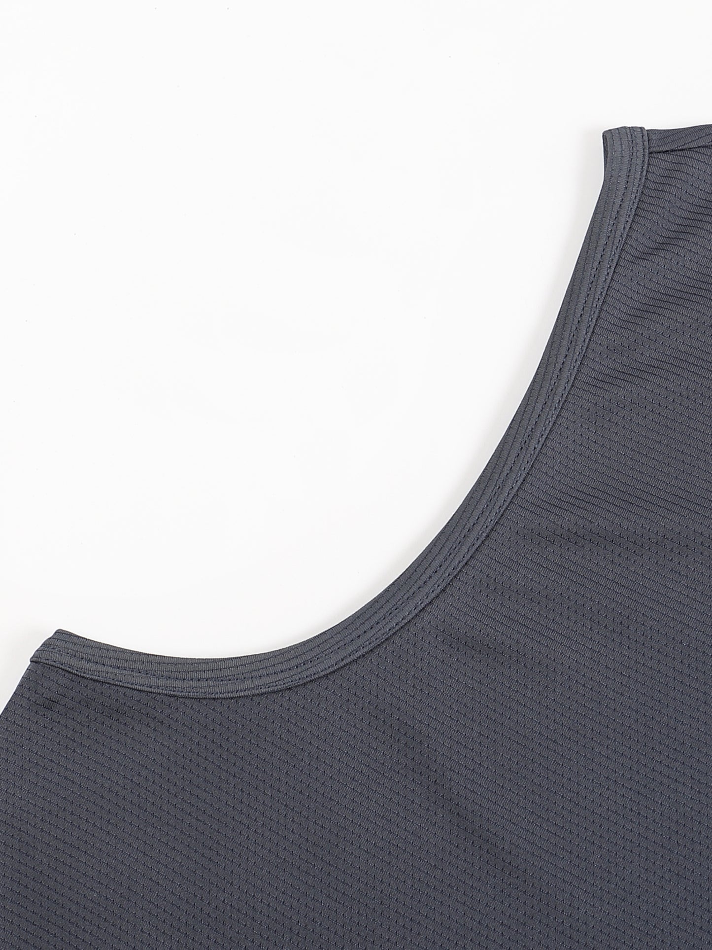Close-up of a gray tank top on a white background