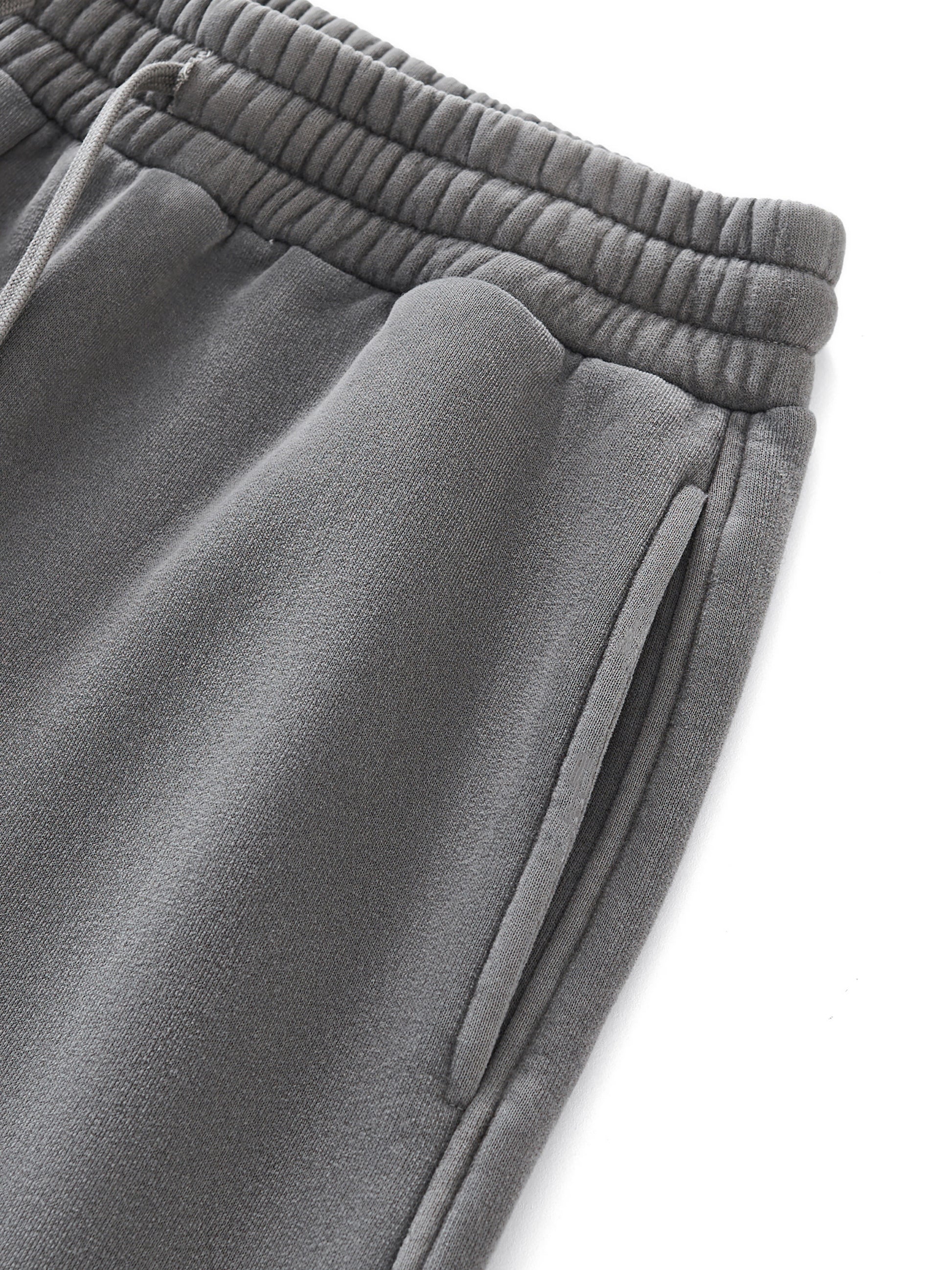 Gray sweatpants with an elastic waistband on a white background