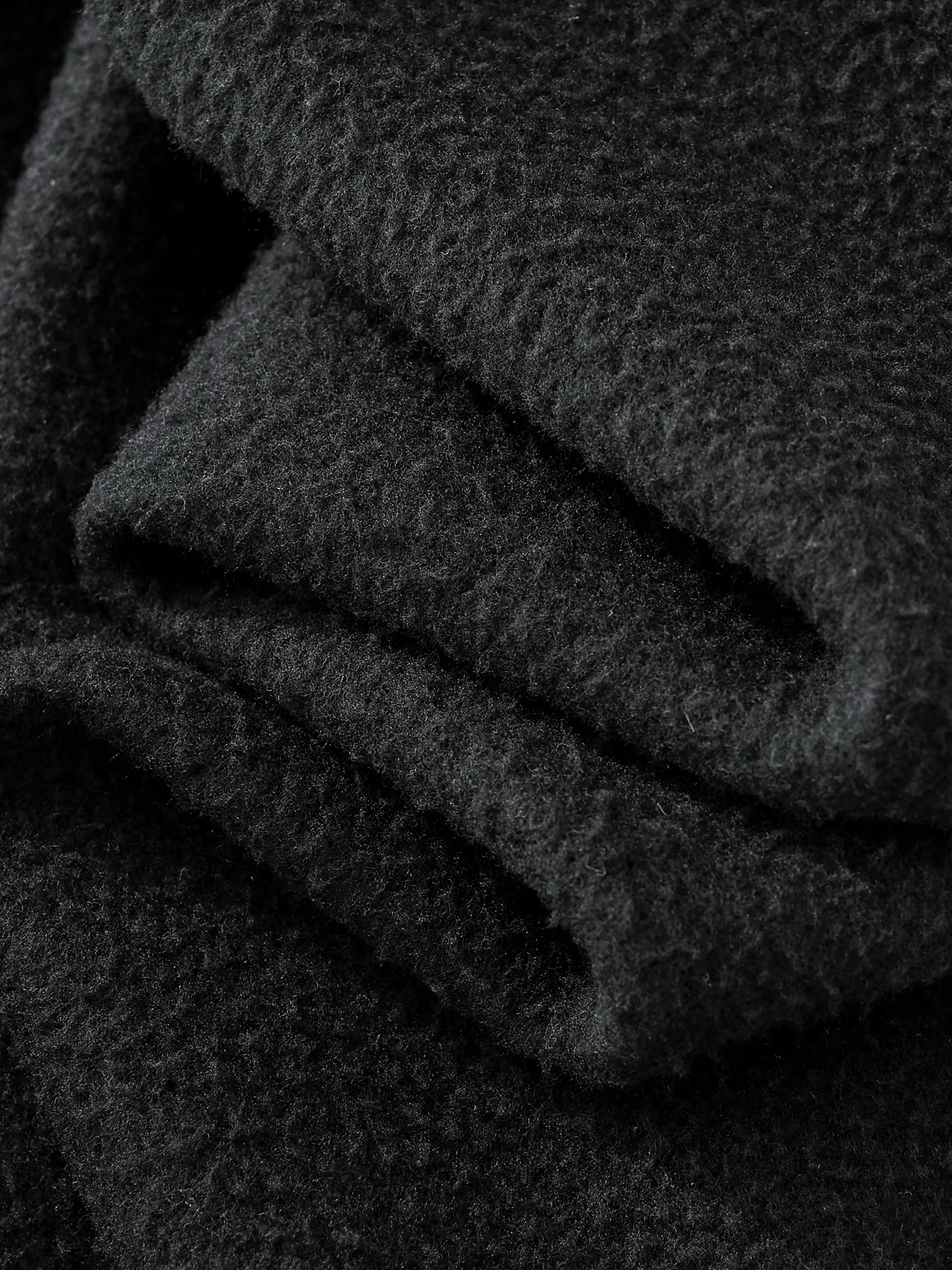 Close-up of black fabric with a textured surface