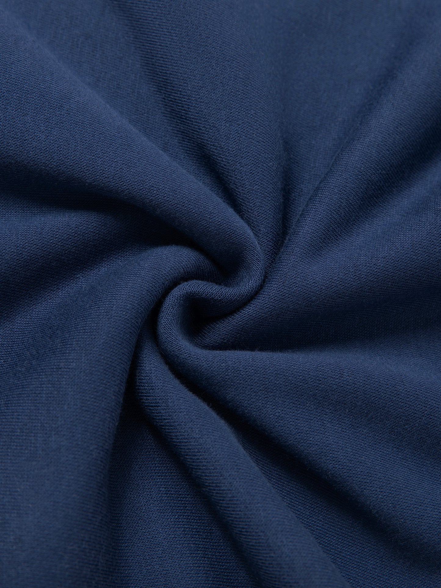 Close-up of dark blue fabric with folds