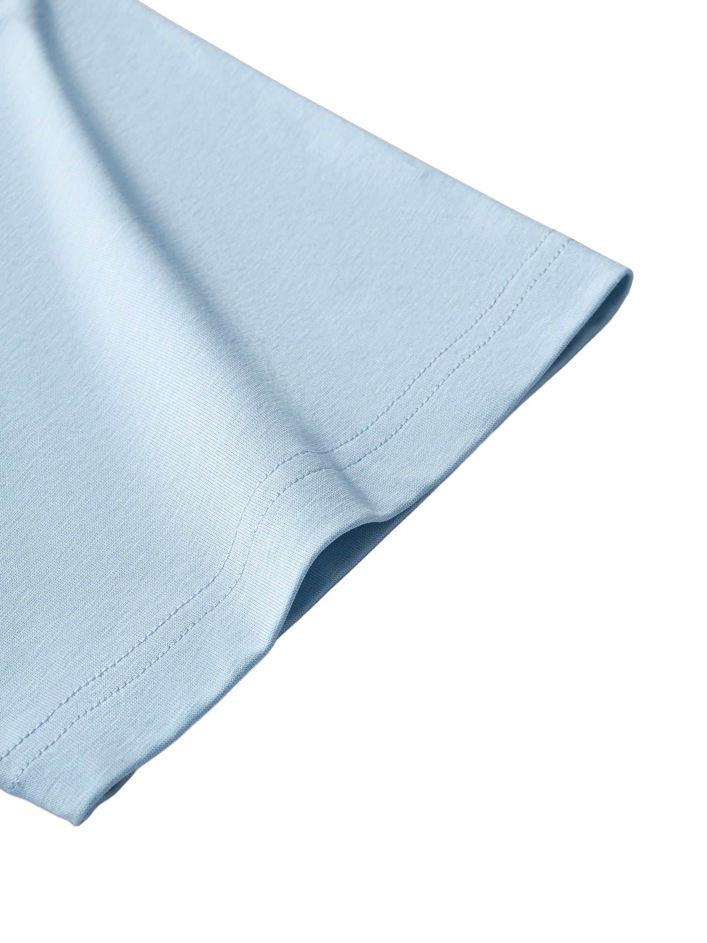 Close-up of a light blue fabric corner on a white background
