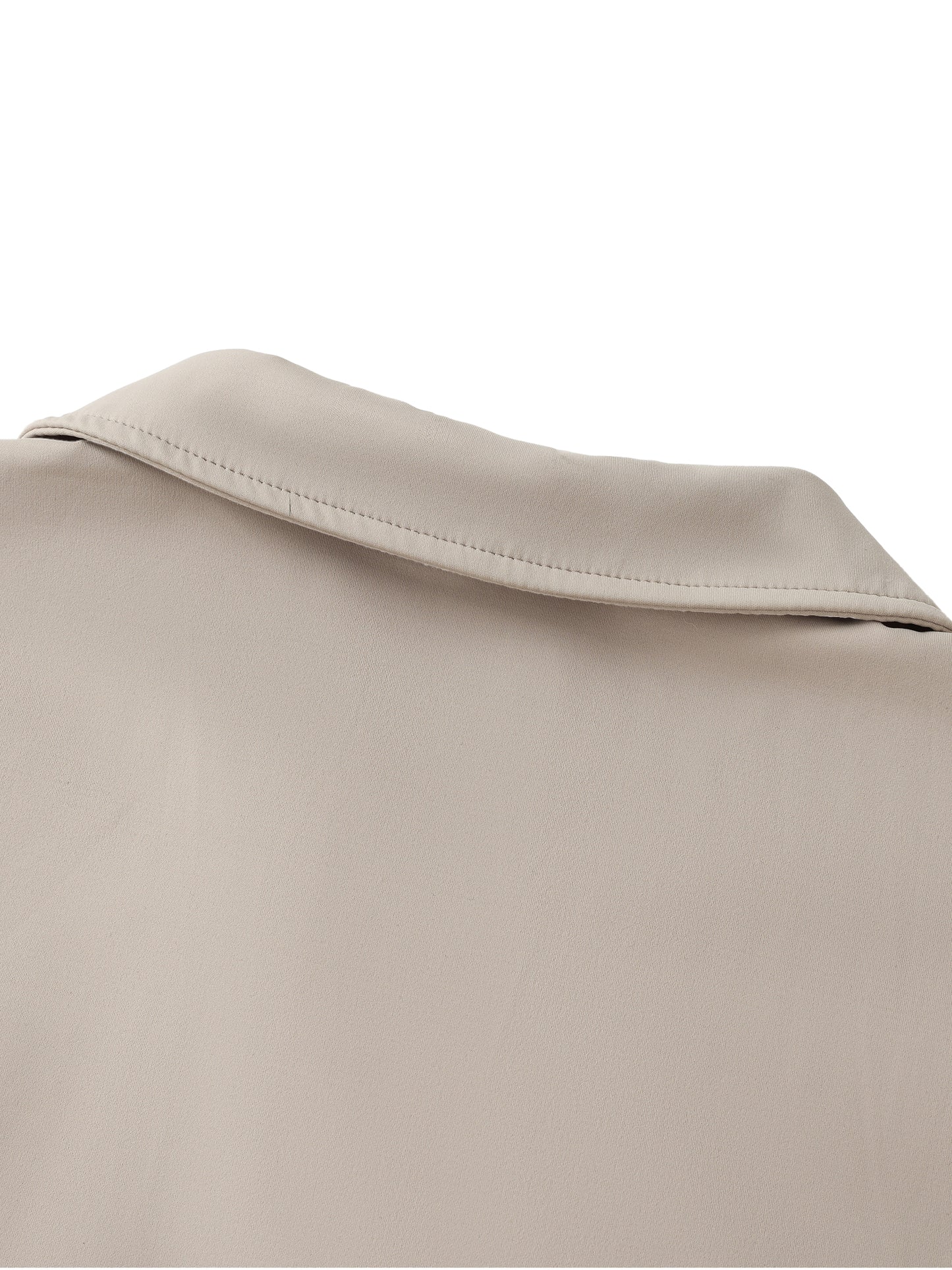 Close-up of a beige fabric texture with a collar