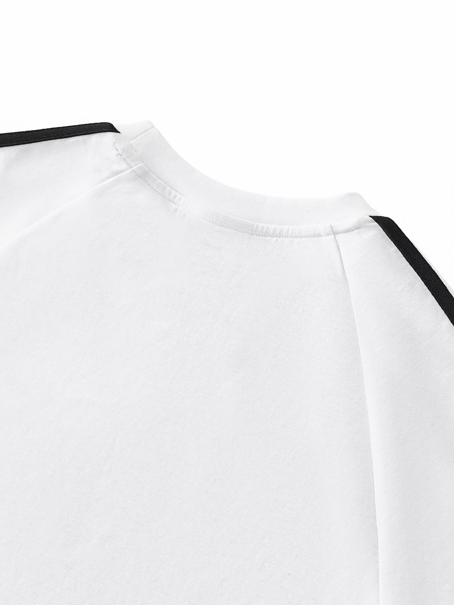 Close-up of a white shirt with black accents on a white background