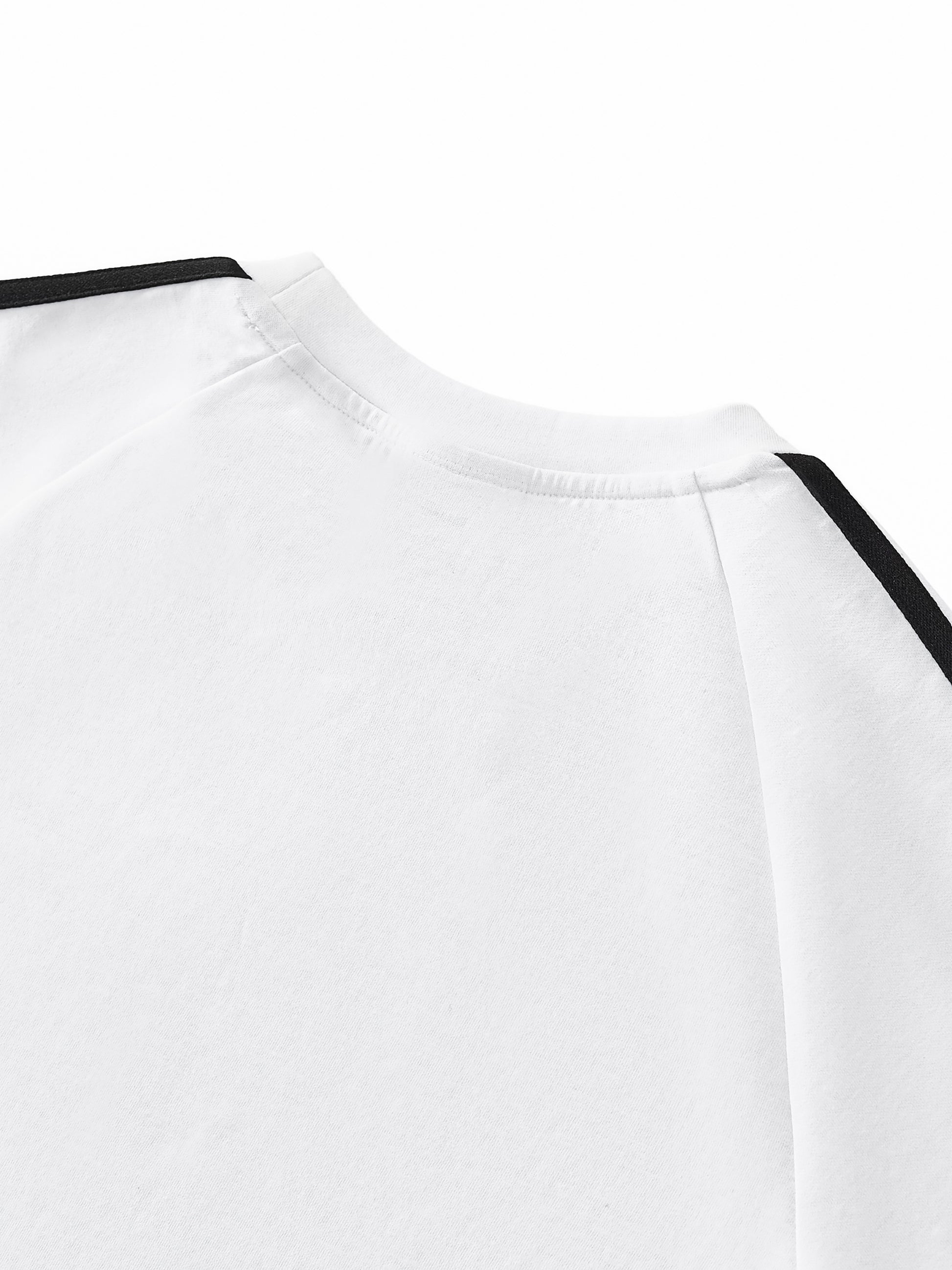 Close-up of a white shirt with black accents on a white background