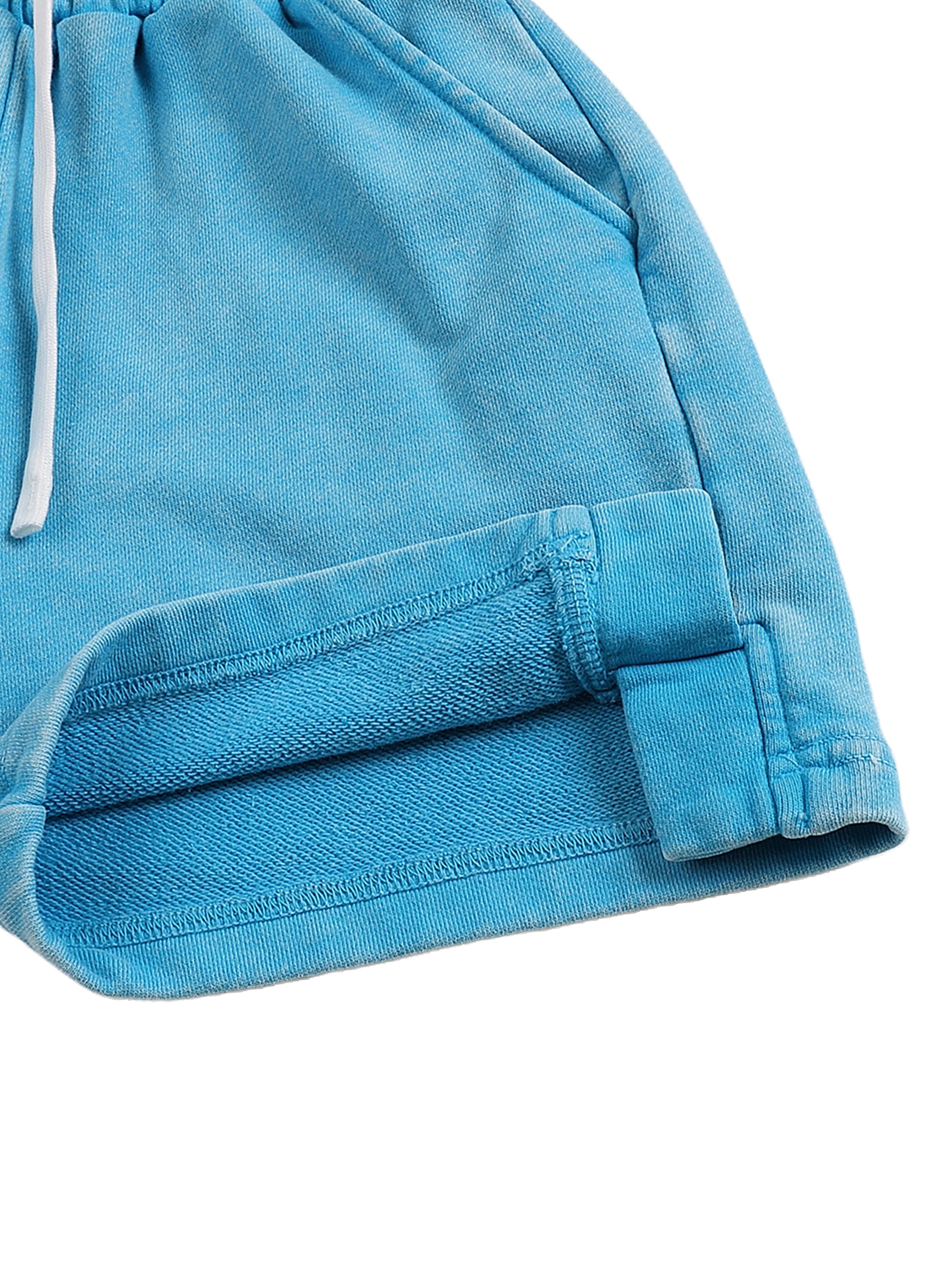 Close-up of blue shorts with a white drawstring on a white background